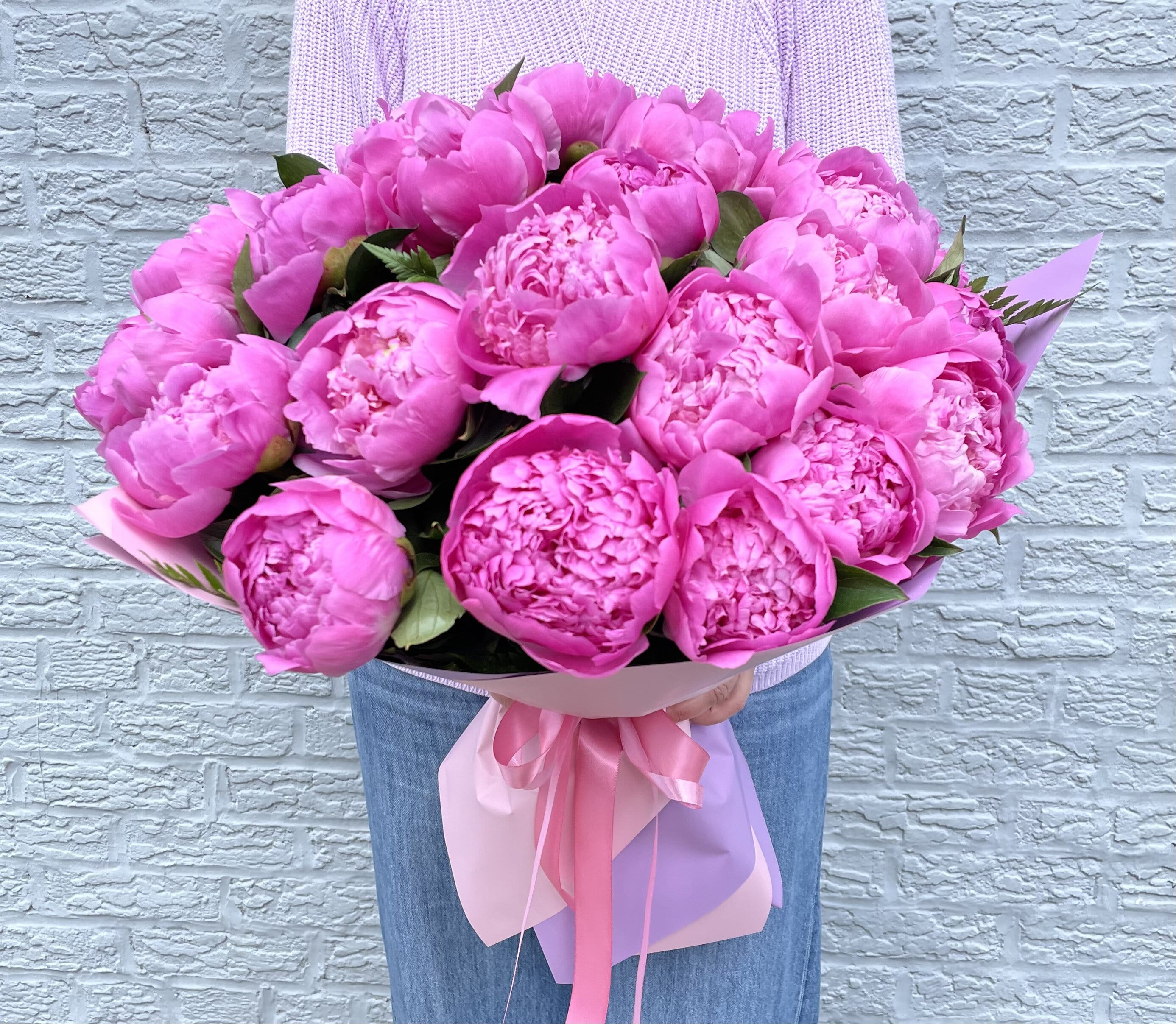 pink peonies bouquet.    The photo shows a deluxe size. - The photo shows a deluxe size.