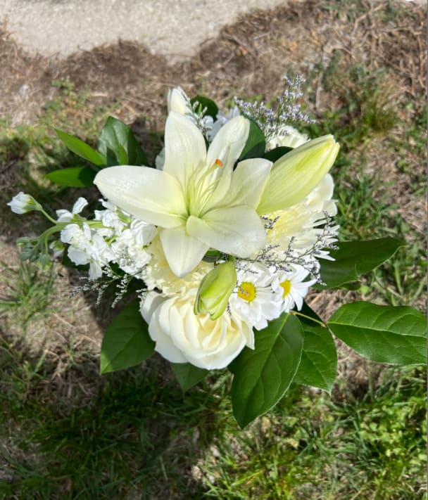 Northmont Mixed White Handheld Bouquet - An elegant hand-tied bouquet that will compliment any prom outfit. Filled with mixed flowers such as roses, daisies, and lilies. *Vase not included*