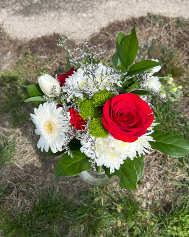 Northmont Red &amp; White Handheld Bouquet - An elegant hand-tied bouquet that will compliment any prom outfit. Filled with mixed flowers such as roses, daisies, and stock. *Vase not included*