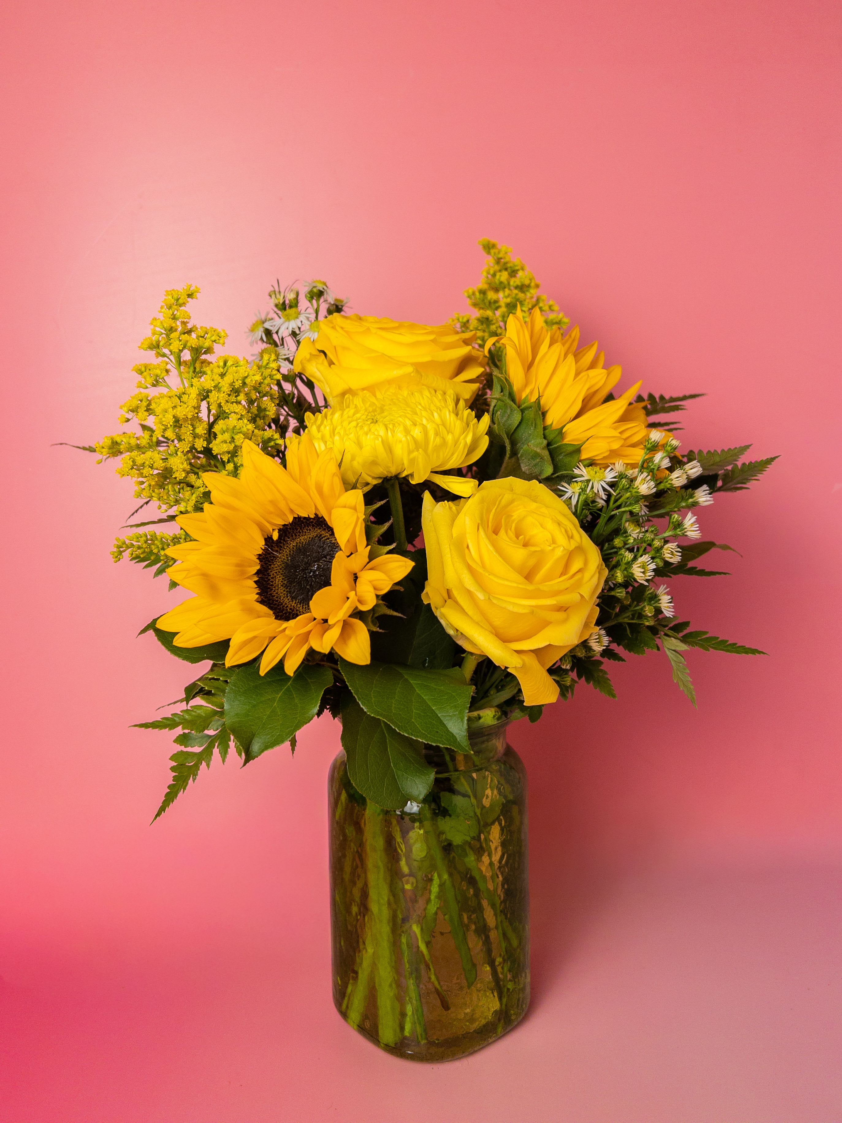 Ray of Sunshine Arrangement - Brighten Mom’s day with Ray of Sunshine, a cheerful Mother’s Day arrangement featuring vibrant yellow flowers displayed in a fresh green vase. This joyful design symbolizes warmth, happiness, and appreciation—making it a perfect way to show gratitude for everything Mom does. Its bright, sunny look brings instant positivity to kitchens, dining tables, and living spaces. As your neighborhood Baltimore Florist, we are proud to create flowers that bring smiles and lasting memories. With reliable Flower Delivery in Baltimore, sending sunshine to Mom has never been easier.