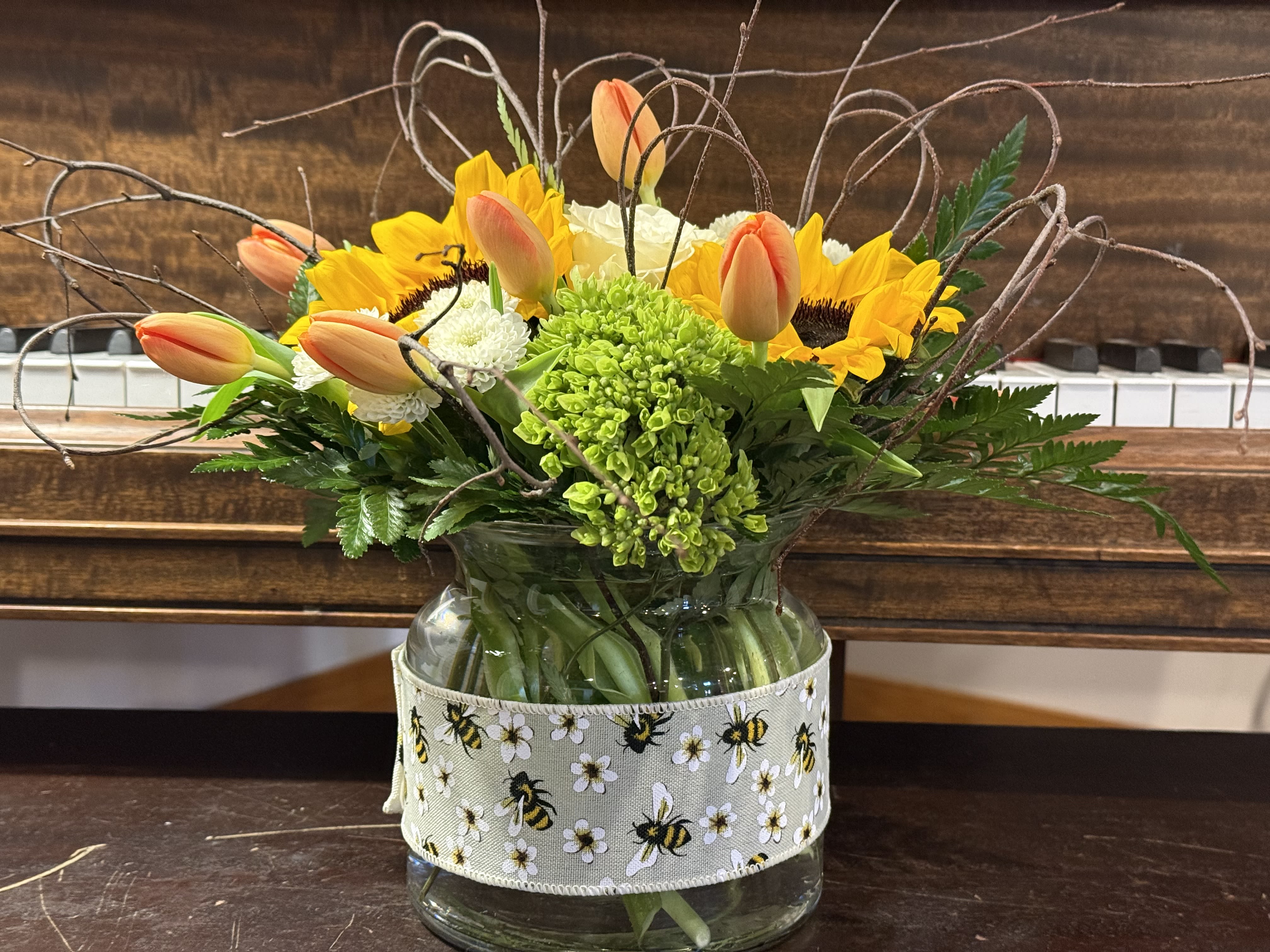 Bee~Cause Mom's the Best! - Brighten Mom's Day with this happy vase of sunflowers, tulips, hydrangeas &amp; birch branches. Vase is wrapped in our popular Bumble Bee Ribbon!