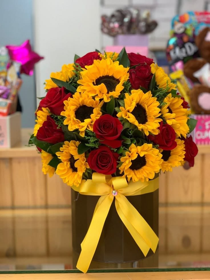 My Honey - A combination that never fails, beautiful sunflowers full of joy with the romance of red roses.