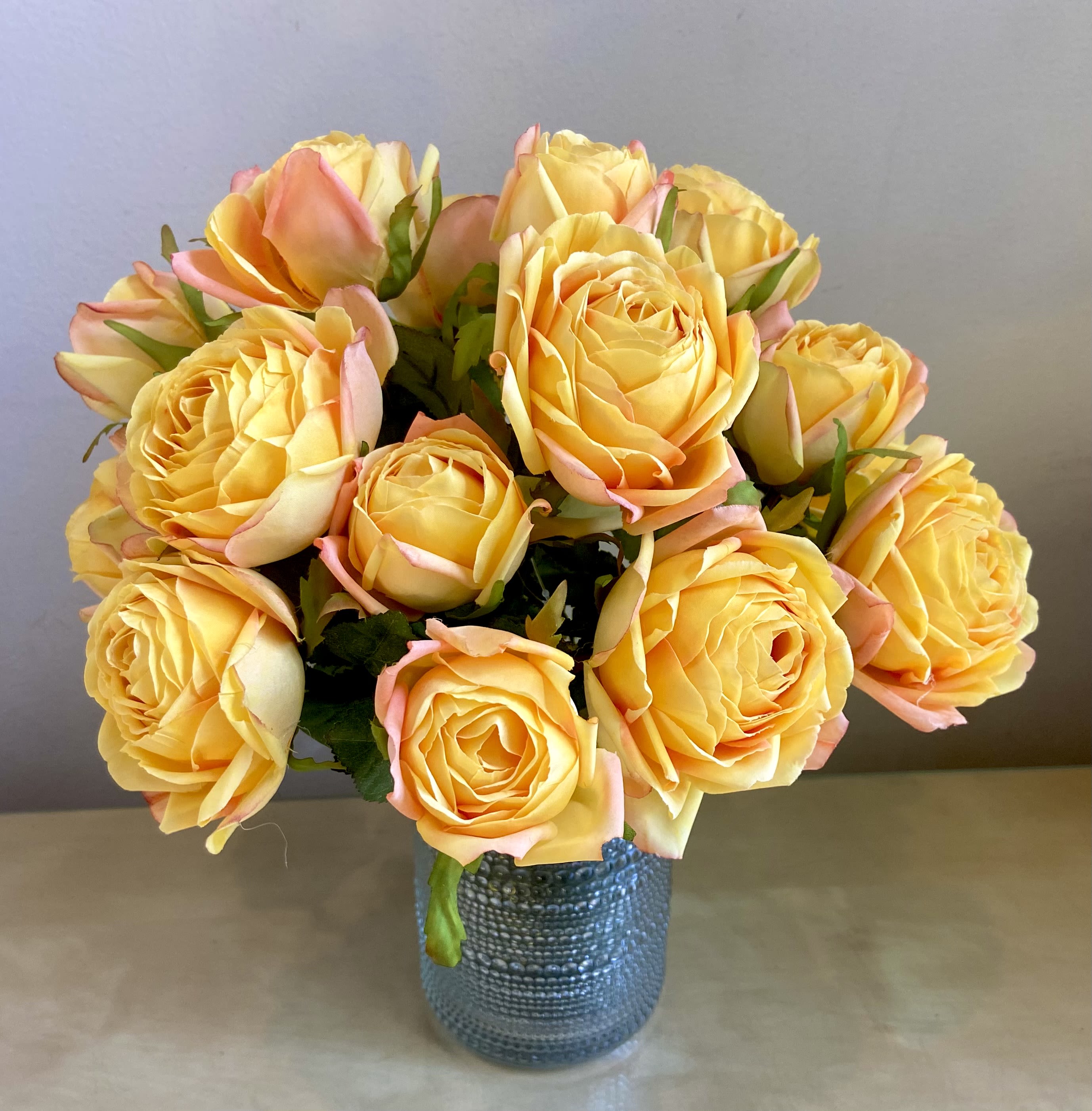Simply Roses - Simple beautiful arrangment of 15 silk yellow roses with orange accents. Look amazingly natural.