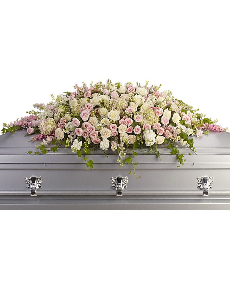 Pastel rose casket spray on a silver casket