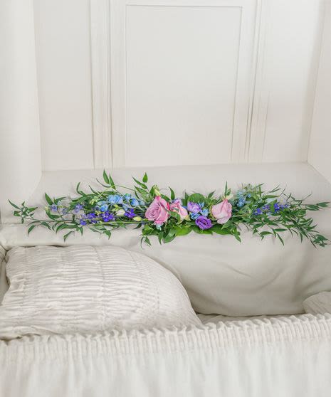Tranquil Gate Casket Arrangement - This casket lid garland is an elegant and understated tribute designed to lie within the open lid of a casket during a memorial service, with cool tones that relay a sense of calm.