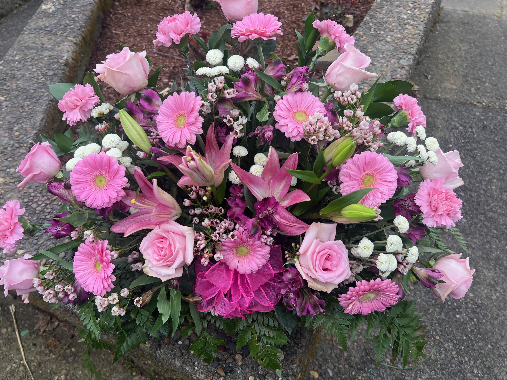 Pink Perfection - A lush bouquet in soft pink with whit accents and deep purple highlights creates a warmth and celebrationc perfect for a birthday, anniversary or Mother's Day. Need a days notice for this arrangement.