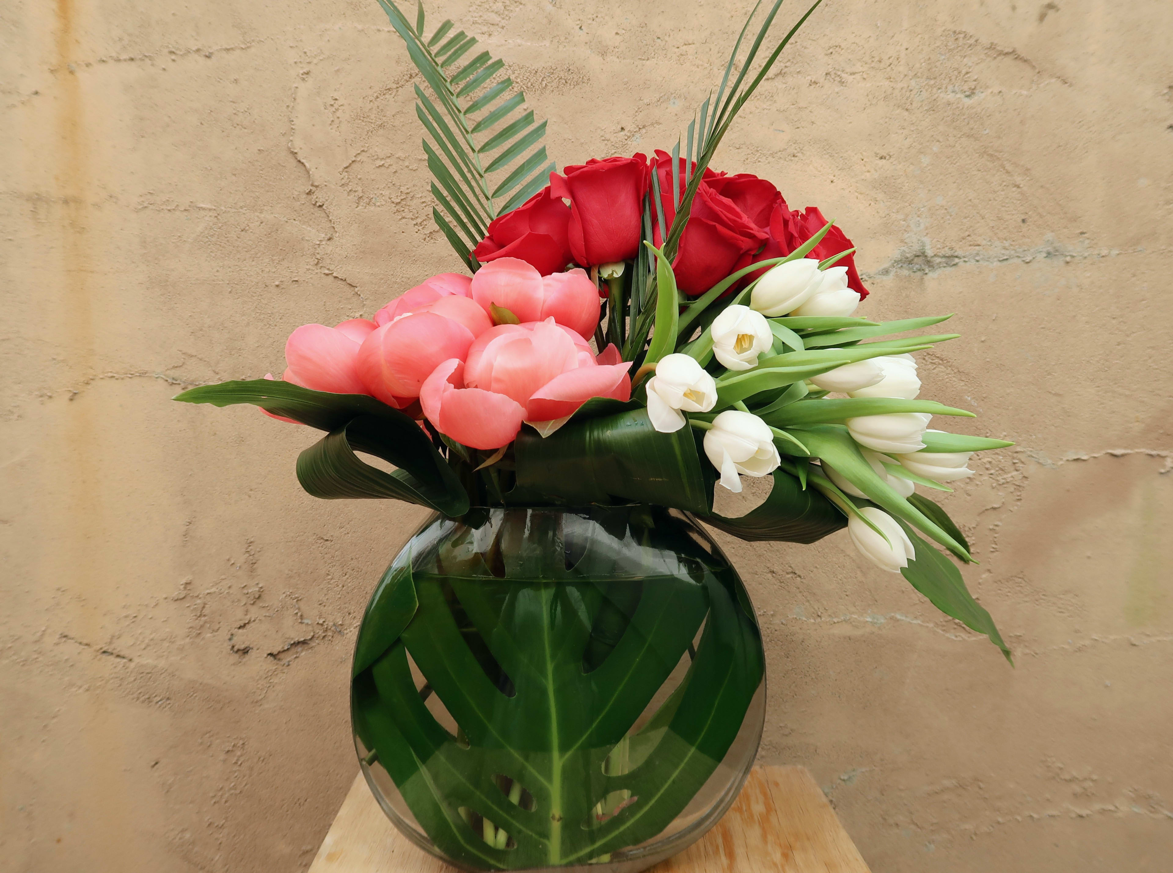 Devotion - Devotion is filled with peonies, tulips, and roses elegantly arranged.