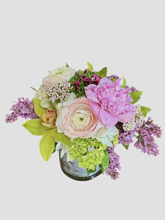 Pastel floral arrangement in a vase with pink and lavender blooms