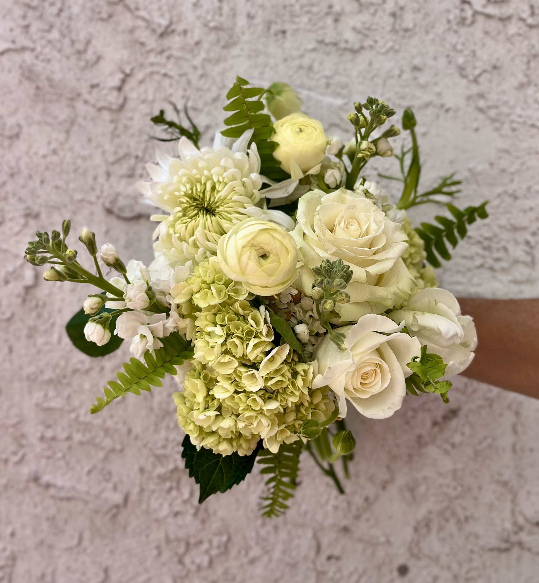 White and pale yellow bouquet with roses, hydrangea, and chrysanthemum