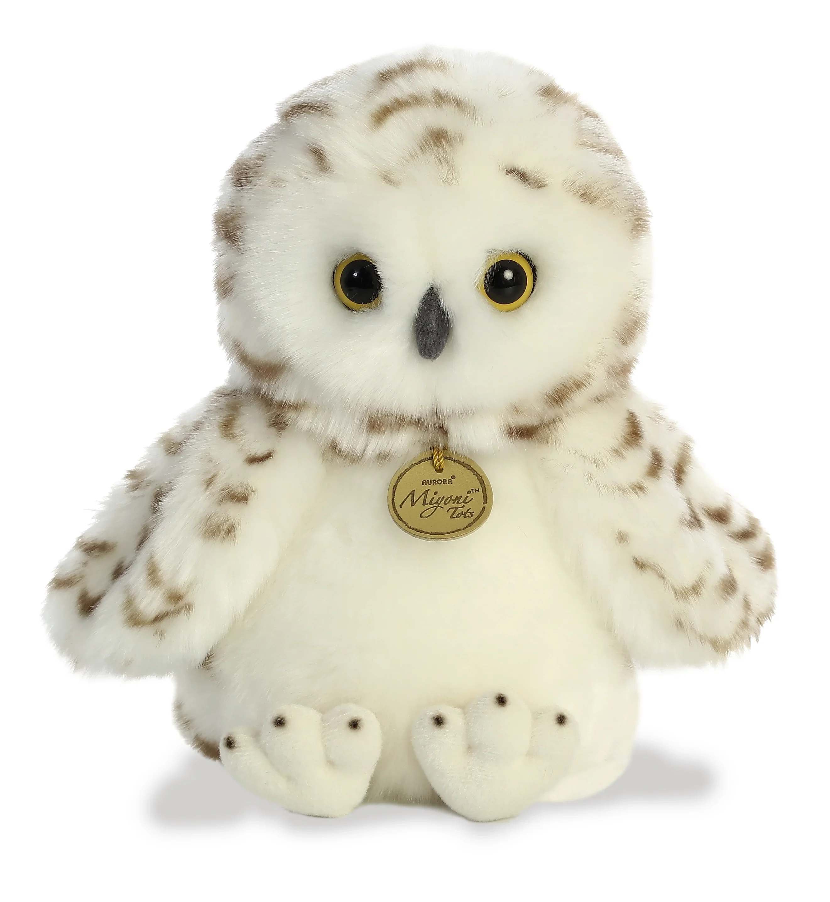 Plush- Snowy Owl - A soft fluffy owl plushy with bright wide eyes and gentle brown markings. This owl gives off a cozy vibe and is an adorable charm perfect for anyone. 