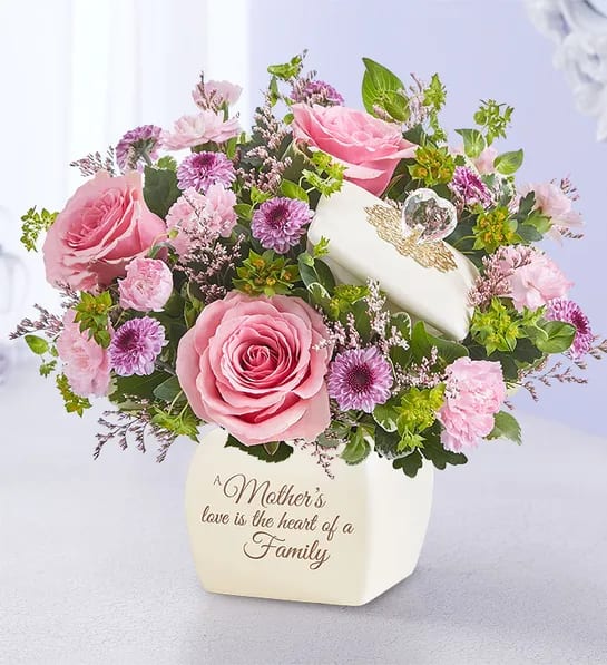 Moms Love - A mother’s love is something to treasure. This sentiment is so beautifully captured in our garden-inspired bouquet, featuring a mix of pastel blooms in our vintage-inspired canister. With an elegant, floral-embellished lid and heartfelt message, this timeless keepsake can later be used to hold jewelry or trinkets for a lasting reminder of the special bond you share.