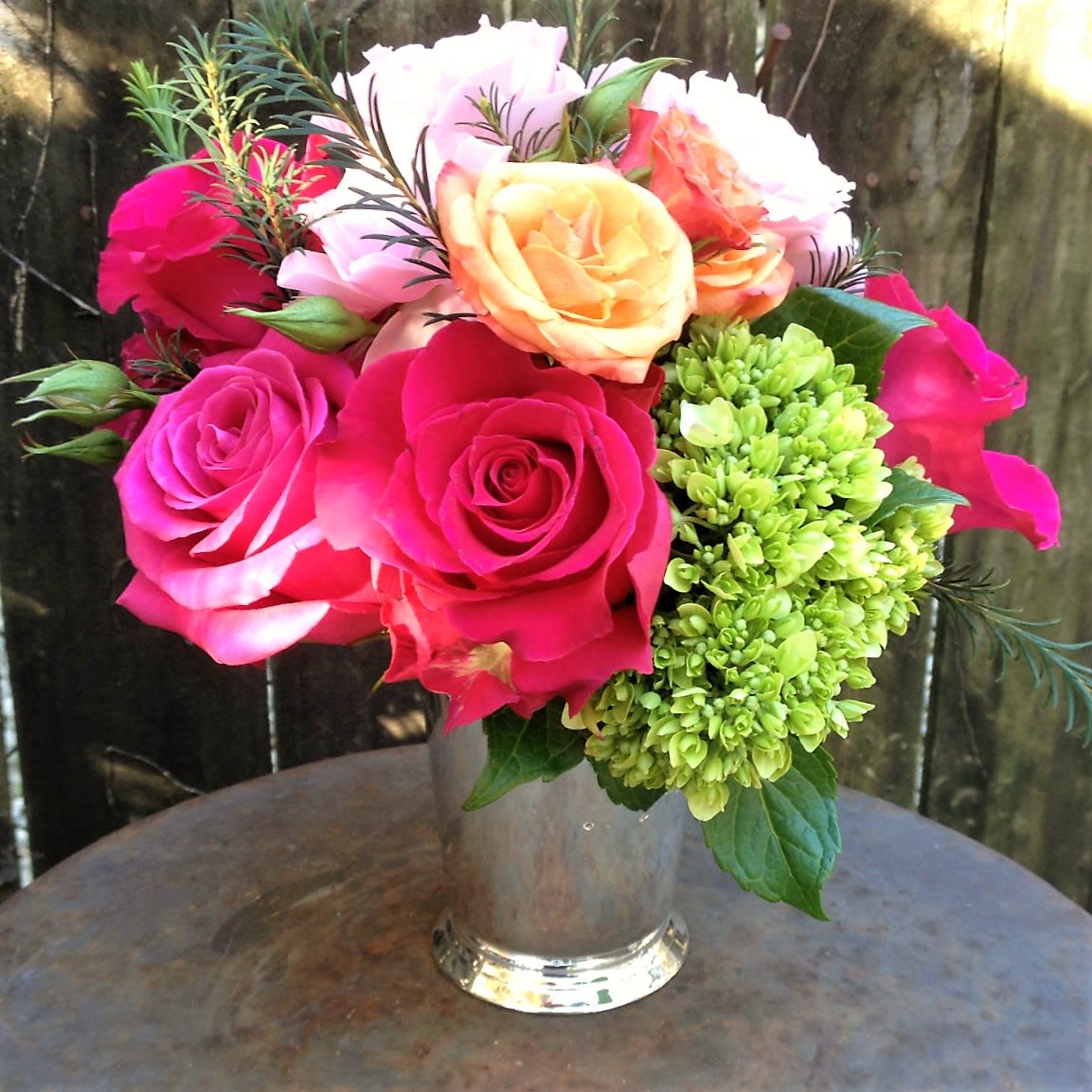 Julep Cup Posey - Southern Charm with a Timeless Touch Experience the elegance of a Southern tradition with our "Julep Cup Posey." This delightful arrangement features cool melon-toned fresh flowers, beautifully arranged in our signature silver-tone julep cups, offering a charming and sophisticated display for any occasion. **Melon-Toned Blooms: A refreshing palette of soft, warm hues brings a touch of Southern warmth and elegance to your setting. **Signature Julep Cup: The silver-tone julep cup is not only a stylish vessel for the flowers but also serves as a lovely keepsake, adding lasting value to your gift. **Year-Round Tradition: Perfect for any time of year, this arrangement embodies the grace and hospitality of the South, making it an ideal choice for celebrations or thoughtful gestures. Choose the "Julep Cup Posey" from Elizabeth's Garden to enjoy a piece of southern tradition that combines beauty and keepsake value, perfect for those who appreciate timeless elegance.