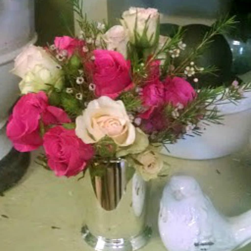 Julep Cup - A Classic and Lovely Gift The "Julep Cup" arrangement is a gift that continues to bring joy long after the flowers have faded. This exquisite piece features a deluxe and premium version with soft and light pink petite roses, complemented by a favorite pink garden rose variety, all beautifully arranged in a timeless julep cup. Standard version includes only shades of varying petite roses. Enduring Keepsake: The julep cup serves as a lasting memento, creating a happy memory each time the recipient glances at it, even after the blooms have gone. Elegant Floral Display: Soft pink roses and garden roses offer a delicate and sophisticated look, perfect for any occasion. Versatile Use: Beyond its initial use as a vase, the julep cup can be repurposed for various decorative or functional purposes, adding charm to any setting. Celebrate life's special moments with the "Julep Cup" from Elizabeth's Garden, where elegance meets enduring beauty. This arrangement is not just a gift; it's a cherished memory in the making.