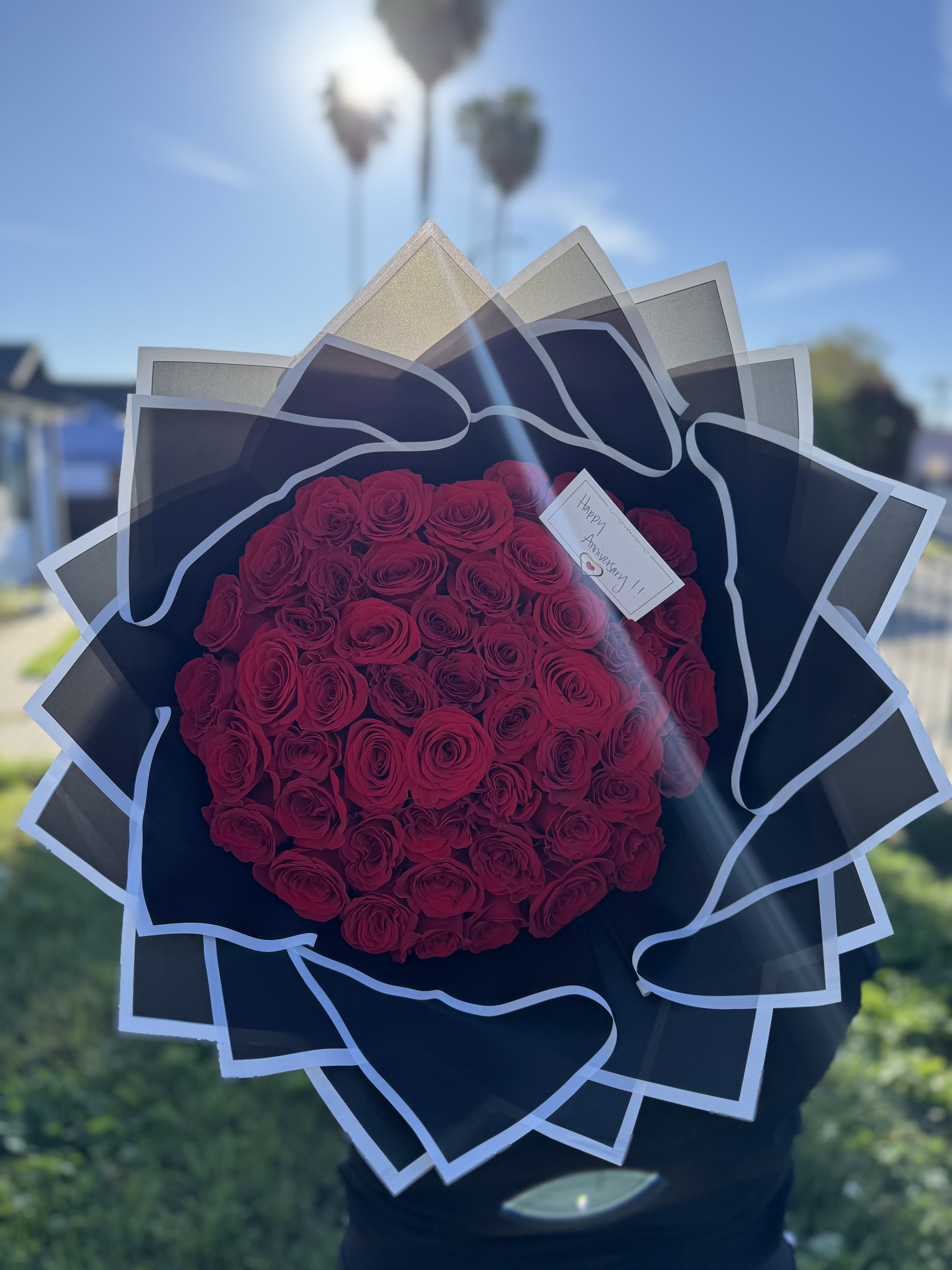 Red Ramo Buchon - 50, 75 &amp; 100ct  - Rose Count: Standard (50 Roses) to deluxe (75 roses) and premium (100 roses).  Colors: Red is classic for romance, if you like a different popular option which includes white, pink, yellow sunflowers, or multi-color combinations, please see other products.  Wrapping: The bouquet is finished in stylish, specialized waterproof wrapping, which you can choose from black, white, pink,  brown, purple, blue, green, yellow, orange among others, please call us if needed to discuss wrapper color.   Add-ons under Personalization Section Personalized touches available include diamond pins in the rose centers, butterflies, or custom banners. Bouquets are frequently paired with extras like teddy bears, "I Love You" balloons, or gourmet chocolate boxes.   BOUQUET COMES ONLY AS ROSES AND WRAPPING, accessories like ribbon, vase, teddy bears etc, have an extra cost, please add them under Accessories   