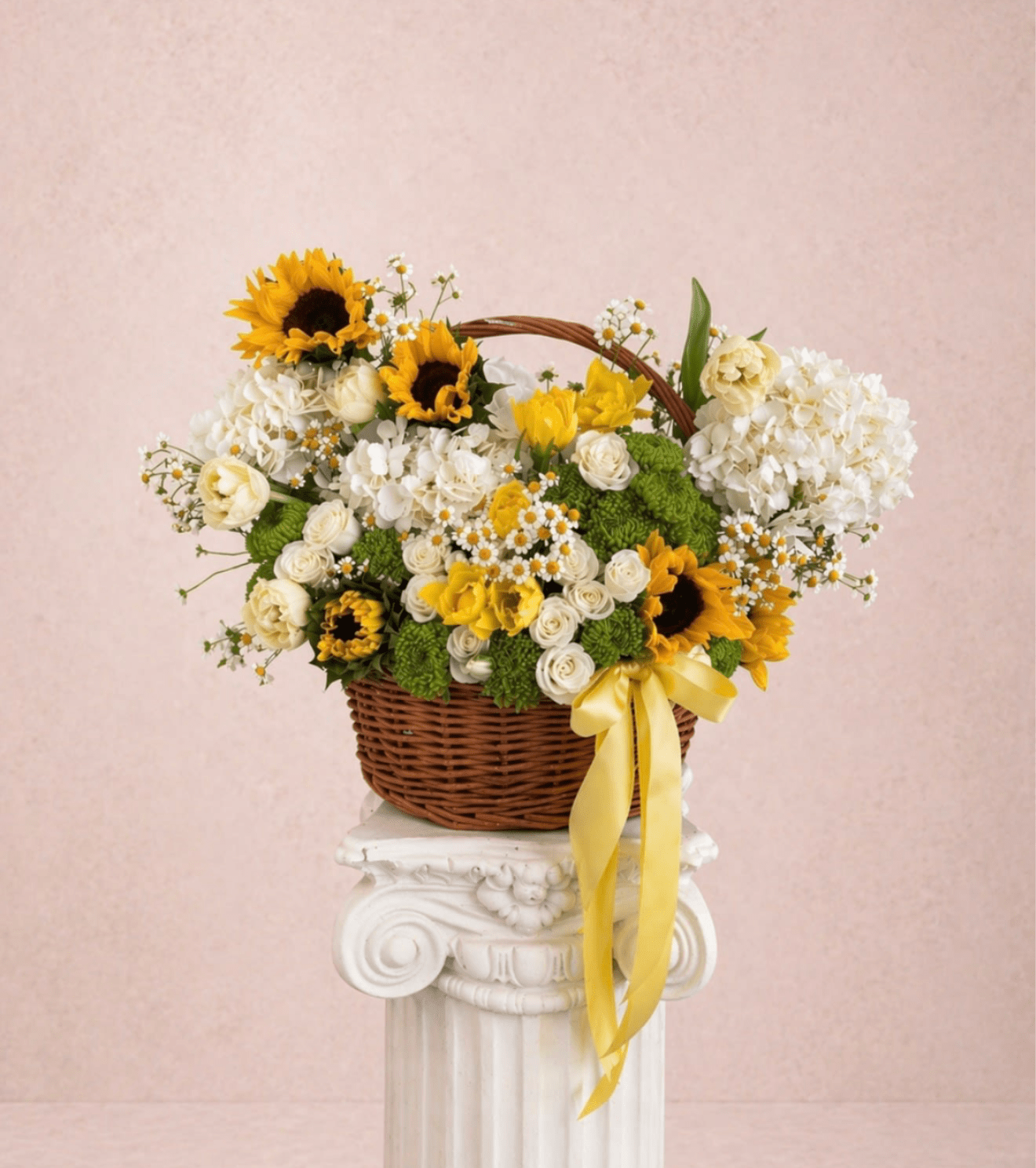 Sunshine  - Brighten any space with our Elegant Flower basket Arrangement! Bursting with vibrant blooms, this stunning display combines seasonal favorites with lush fillers.  Housed in a chic, reusable container, it makes a perfect centerpiece for any occasion be it a gift or a treat for yourself. Elevate your decor with this captivating arrangement that brings joy and sophistication to your home or office. Order yours today and let the beauty of flowers inspire you!