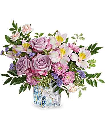 Teleflora Written in the Sky Bouqt - Lavender Roses, Lavender Alstromeria, Pink Mini Carnations, Lavender Cushions or Daisies and Lavender or Purple Statice. We will fill as close to the Picture as we can. 