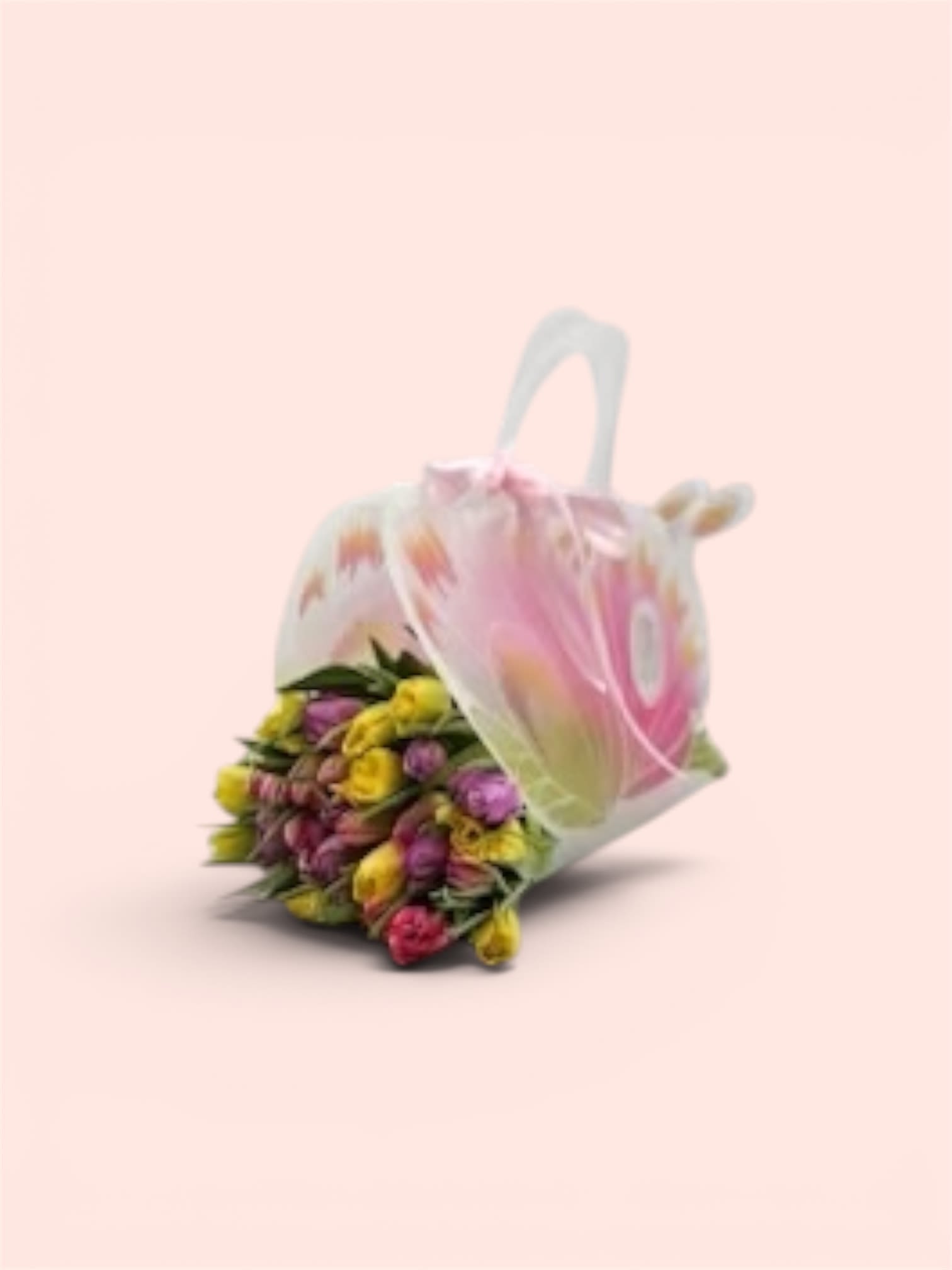 Mother’s Day Special #3 - A cheerful cluster of tulips in bright pinks, sunny yellow, soft purple and crisp white makes a lively gift bouquet that will immediately lift the person you're thinking of. This flower arrangement is perfect as a Mother's Day bloom, a springtime birthday pick-me-up, or a spontaneous thank-you that reads fresh and thoughtful rather than formal.  The tulips are gathered low and loosely for a natural, hand-held silhouette that highlights their smooth, satiny petals and graceful stems. They're presented in a translucent decorative gift bag with soft pastel graphics, finished with a pink ribbon tied at the handle for easy carrying and an instant-gift look. The compact size is designed to feel casual and approachable while still delivering a bright, joyful impression.  For the recipient, this bouquet says cheerful appreciation-ideal for a mom, teacher, friend, or anyone who loves spring colors. The arrangement arrives ready to present in its bag; if you want to keep the tulips longer, transfer them to fresh water in a vase and recut stems for best longevity.