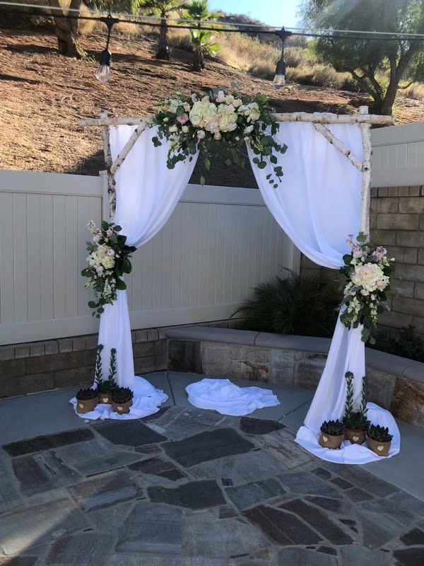 Rustic Elegance Summer Arch - This 3 piece arch includes Roses, Dahlias, Peonies, Hydrangae, Eucalyptus and more!  Availability: Dahlias and Peonies seasonal Substitution available: Yes  Must be ordered at least 5 days in advance. 