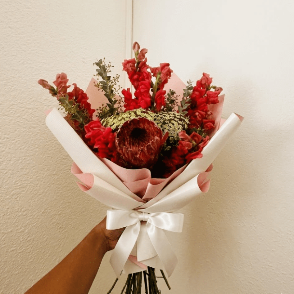 Garden Party - Lush, organic, and elegant—Garden Party is a sophisticated take on the classic birthday bunch. The architectural height of snapdragons is softened by the delicate texture of Queen Anne’s Lace and trailing garden greens.  This seasonal bouquet features:  Hot Pink Snapdragons  Queen Anne’s Lace  Fresh Boxwood  Garden Greens  Presentation: Expertly wrapped in our signature textured paper and tied with satin ribbon. Prefer a vase? Add one to your cart to complete the look.  Personal Touch: We’ll include a custom card message with every order. You’ll be able to write your message at checkout.  Please Note: All flowers are subject to seasonal availability. If a specific bloom isn’t available, our designers will thoughtfully substitute with flowers in a similar shape, style, and color.  Standard size shown. Vase upgrade is optional.   Floral Care Guide  Your arrangement arrives in our signature "double wrap" and is nestled in a protective box. While the stems are secured with a wet wrap for transit they are ready for a full drink!   Unpack: Gently lift the bouquet from the box. Remove the plastic bag and wet towel from the stems. Trim &amp; Hydrate: Trim 1/2" off stems at an angle and place in a clean vase with cool water. Refreshed: Change water daily for a long-lasting bloom.  