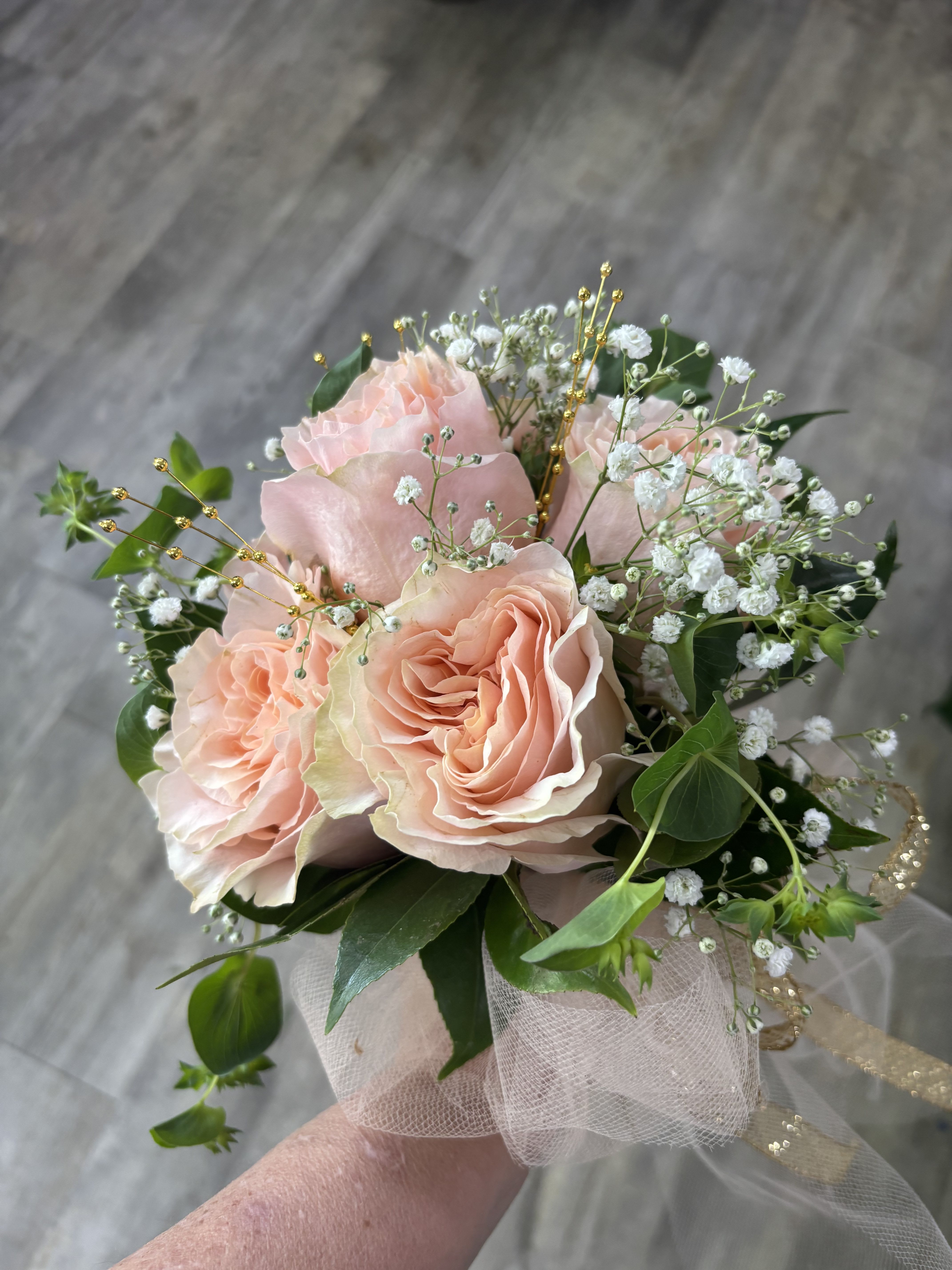 6 Rose Prom Bouquet - Make prom night unforgettable with our elegant 1/2 Dozen Rose Prom Bouquet, handcrafted with six premium roses, fresh greenery, ribbon detail, and sparkling jewelry accents for a polished, photo-ready look. This hand-tied bouquet is designed to complement prom dresses and create a beautiful finishing touch for one of the biggest nights of the year.  Customize your bouquet to match your style. Simply include your preferred rose color and jewelry accent color in the Special Instructions at checkout. Popular choices include blush pink, red, white, lavender, black, blue, champagne, hot pink, and classic ivory. Jewelry accents may vary based on availability and designer selection.  Perfect for prom, homecoming, winter formal, spring formal, senior walk-ins, and dance photos. Each bouquet is professionally designed by Aspen Tower Florist using fresh flowers and quality materials for a secure, comfortable carry throughout the evening.  We proudly create custom prom flowers in Greensburg, Indiana, and surrounding communities including Rushville, Batesville, Shelbyville, North Vernon, Hope, Westport, and nearby areas. Matching corsages, boutonnières, and wristlets may also be available.  Order early during prom season for best color selection and custom design options. Let Aspen Tower Florist help you arrive in style with a bouquet that feels personal, elegant, and unforgettable.