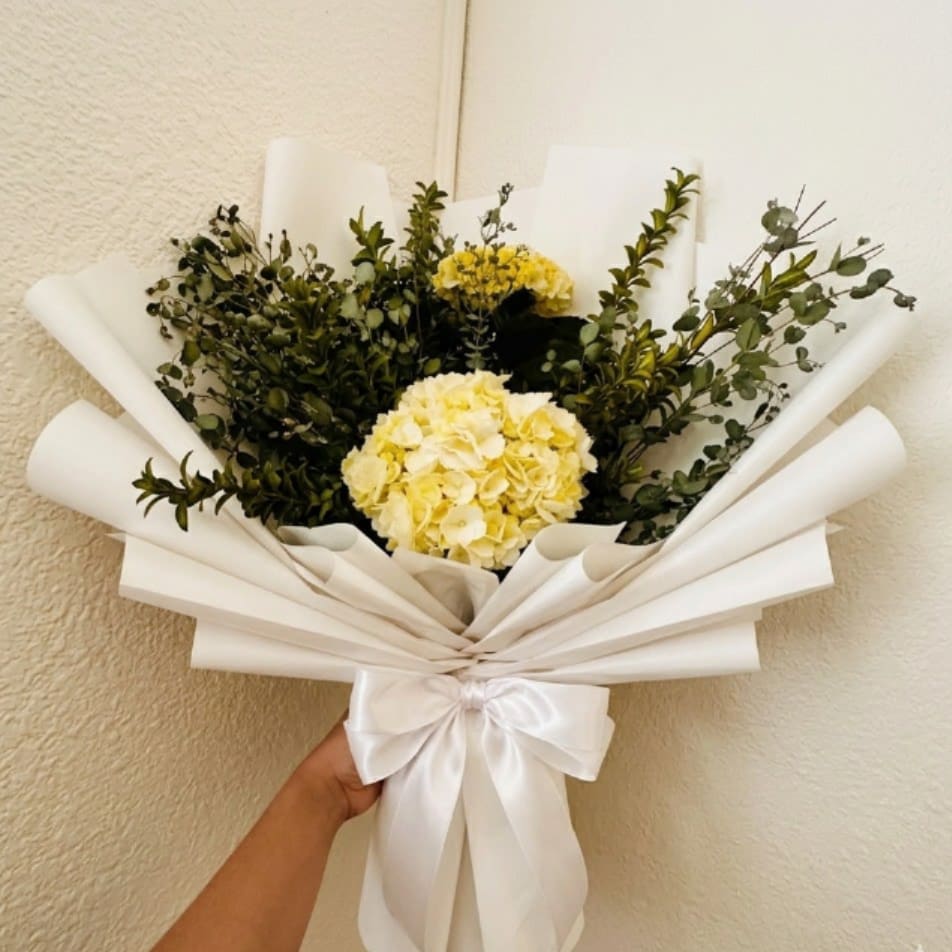 Minty Fresh - Cooling, clean, and spa-like—Minty Fresh uses the clearing fragrance of eucalyptus to aid in wellness. This all-green design is a modern and functional way to wish someone a speedy return to health.  This seasonal bouquet features:  Mini Green Hydrangea  Silvery Gunni Eucalyptus  Fresh Boxwood  Garden Greens  Presentation: Expertly wrapped in our signature textured paper and tied with satin ribbon. Prefer a vase? Add one to your cart to complete the look.  Personal Touch: We’ll include a custom card message with every order. You’ll be able to write your message at checkout.  Please Note: All flowers are subject to seasonal availability. If a specific bloom isn’t available, our designers will thoughtfully substitute with flowers in a similar shape, style, and color.  Standard size shown. Vase upgrade is optional.   Floral Care Guide  Your arrangement arrives in our signature "double wrap" and is nestled in a protective box. While the stems are secured with a wet wrap for transit they are ready for a full drink!   Unpack: Gently lift the bouquet from the box. Remove the plastic bag and wet towel from the stems. Trim &amp; Hydrate: Trim 1/2" off stems at an angle and place in a clean vase with cool water. Refreshed: Change water daily for a long-lasting bloom.  