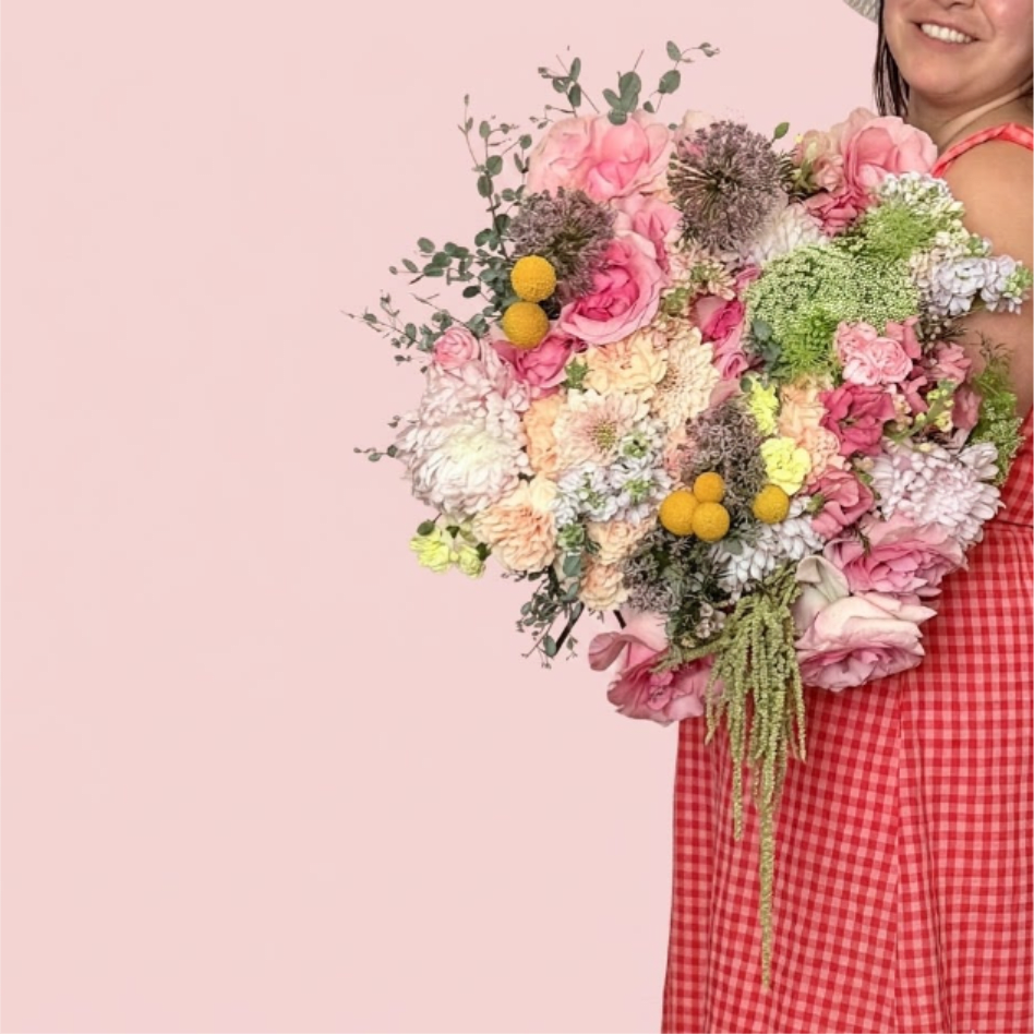 Heritage Bloom - Radiant and majestic—Heritage Bloom is a grand tribute to maternal grace. This massive arrangement is anchored by the rare beauty of allium and a double-digit count of premium roses, creating a dense, lush silhouette that feels like a classic garden masterpiece.   Presentation: Expertly wrapped in our signature textured paper and tied with satin ribbon. Prefer a vase? Add one to your cart to complete the look.  Personal Touch: We’ll include a custom card message with every order. You’ll be able to write your message at checkout.  Please Note: All flowers are subject to seasonal availability. If a specific bloom isn’t available, our designers will thoughtfully substitute with flowers in a similar shape, style, and color.  Standard size shown. Vase upgrade is optional.   Floral Care Guide  Your arrangement arrives in our signature "double wrap" and is nestled in a protective box. While the stems are secured with a wet wrap for transit they are ready for a full drink!   Unpack: Gently lift the bouquet from the box. Remove the plastic bag and wet towel from the stems. Trim &amp; Hydrate: Trim 1/2" off stems at an angle and place in a clean vase with cool water. Refreshed: Change water daily for a long-lasting bloom. 