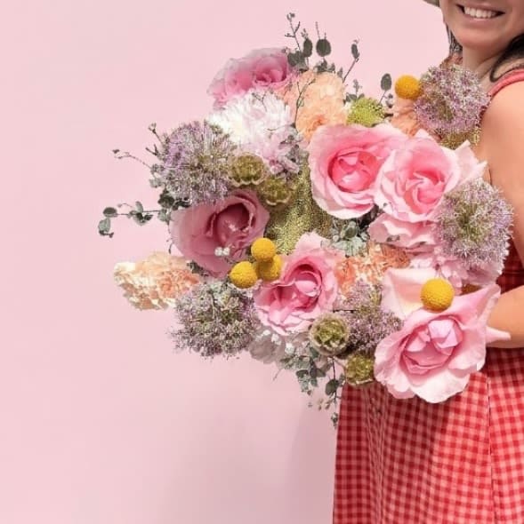 The Matriarch - Opulent and unparalleled—The Matriarch is the pinnacle of our floral studio's artistry. This curated collection features stems that are our rarest and most expensive varieties including allium and roses for a gift that is truly once-in-a-lifetime.  Presentation: Expertly wrapped in our signature textured paper and tied with satin ribbon. Prefer a vase? Add one to your cart to complete the look.  Personal Touch: We’ll include a custom card message with every order. You’ll be able to write your message at checkout.  Please Note: All flowers are subject to seasonal availability. If a specific bloom isn’t available, our designers will thoughtfully substitute with flowers in a similar shape, style, and color.  Standard size shown. Vase upgrade is optional.   Floral Care Guide  Your arrangement arrives in our signature "double wrap" and is nestled in a protective box. While the stems are secured with a wet wrap for transit they are ready for a full drink!   Unpack: Gently lift the bouquet from the box. Remove the plastic bag and wet towel from the stems. Trim &amp; Hydrate: Trim 1/2" off stems at an angle and place in a clean vase with cool water. Refreshed: Change water daily for a long-lasting bloom.   