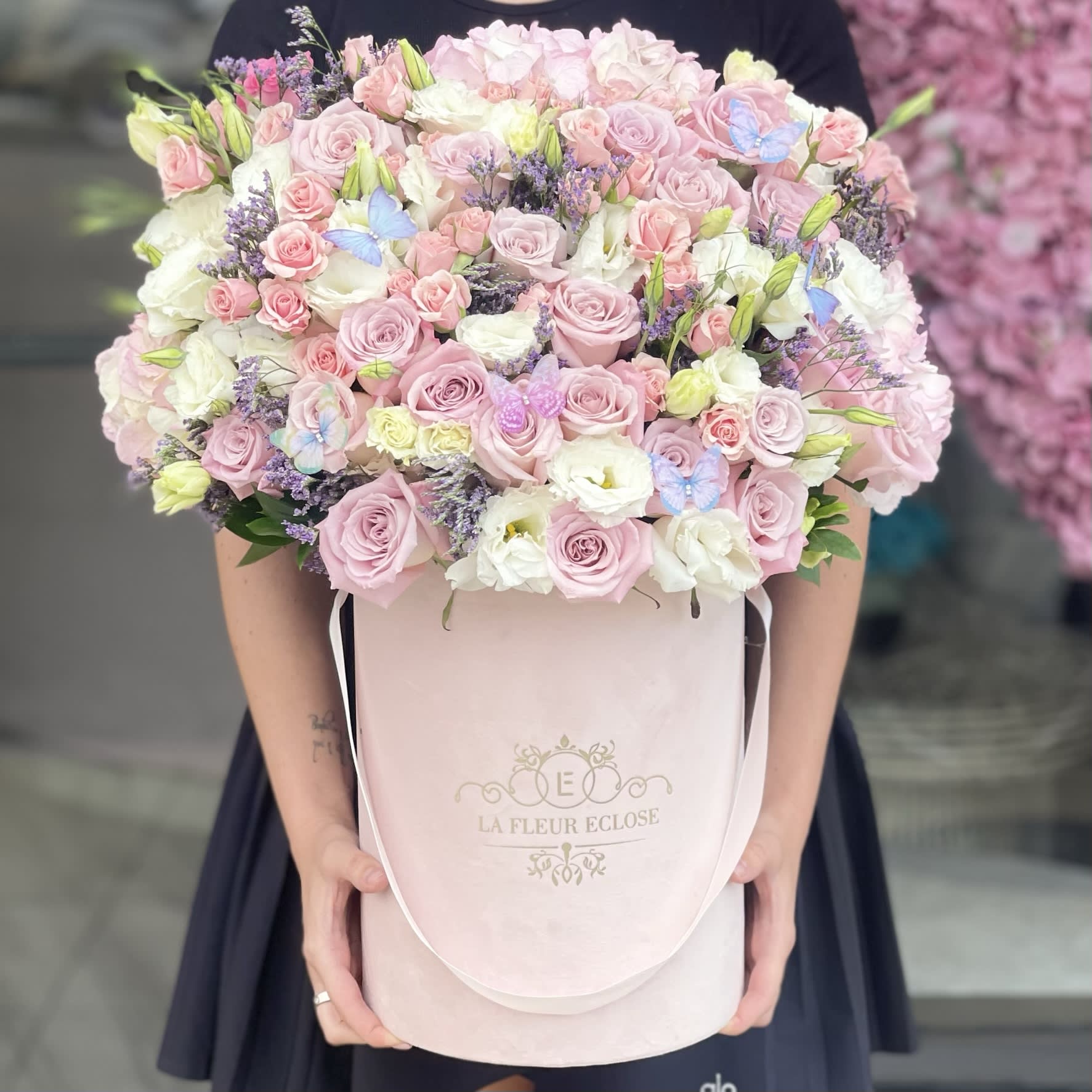 J Lo V - Beautiful pastel color arrangement with little butterflies in it                                            Standard – pictured  Deluxe – the amount of flower will be bigger. We will also put more premium flowers into the arrangement. Premium – the box size will be changed for the bigger one and a lot of premium flowers will be added to the arrangement.                        