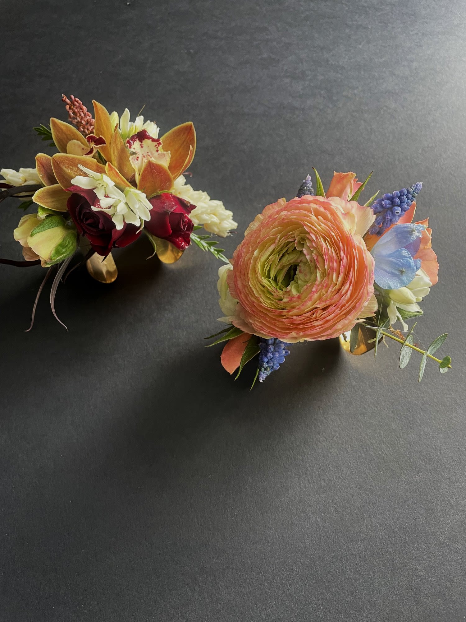 Gold Bracelet Corsage - Corsages are a timeless symbol of tradition and elegance, serving as a beautiful accessory for a special occasion.   The gold bracelet style offers a more modern feel.  Please specify in the notes any color requests for flowers and ribbon color.  Corsages shown here are all just examples of options.  Your corsage will be custom designed to be uniquely yours.