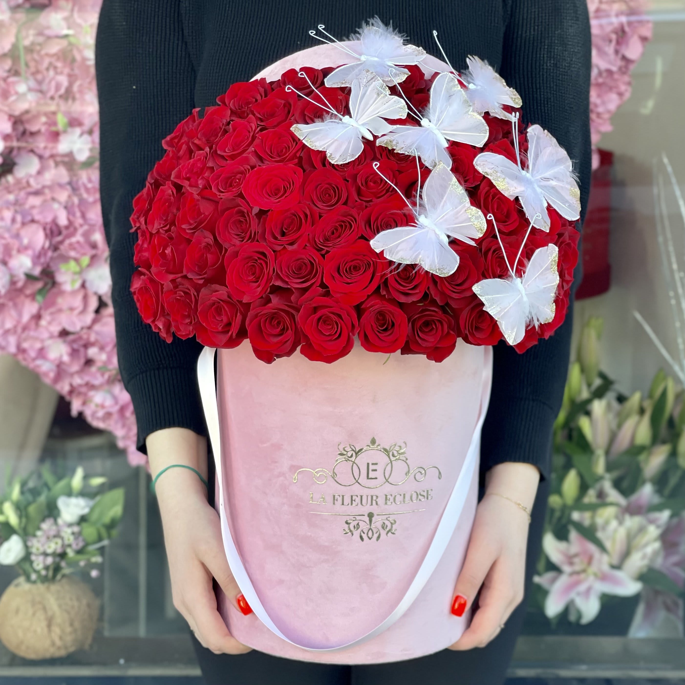 Love Me V - Standard 50 red roses with pink butterflies Deluxe 75 red roses with pink butterflies 