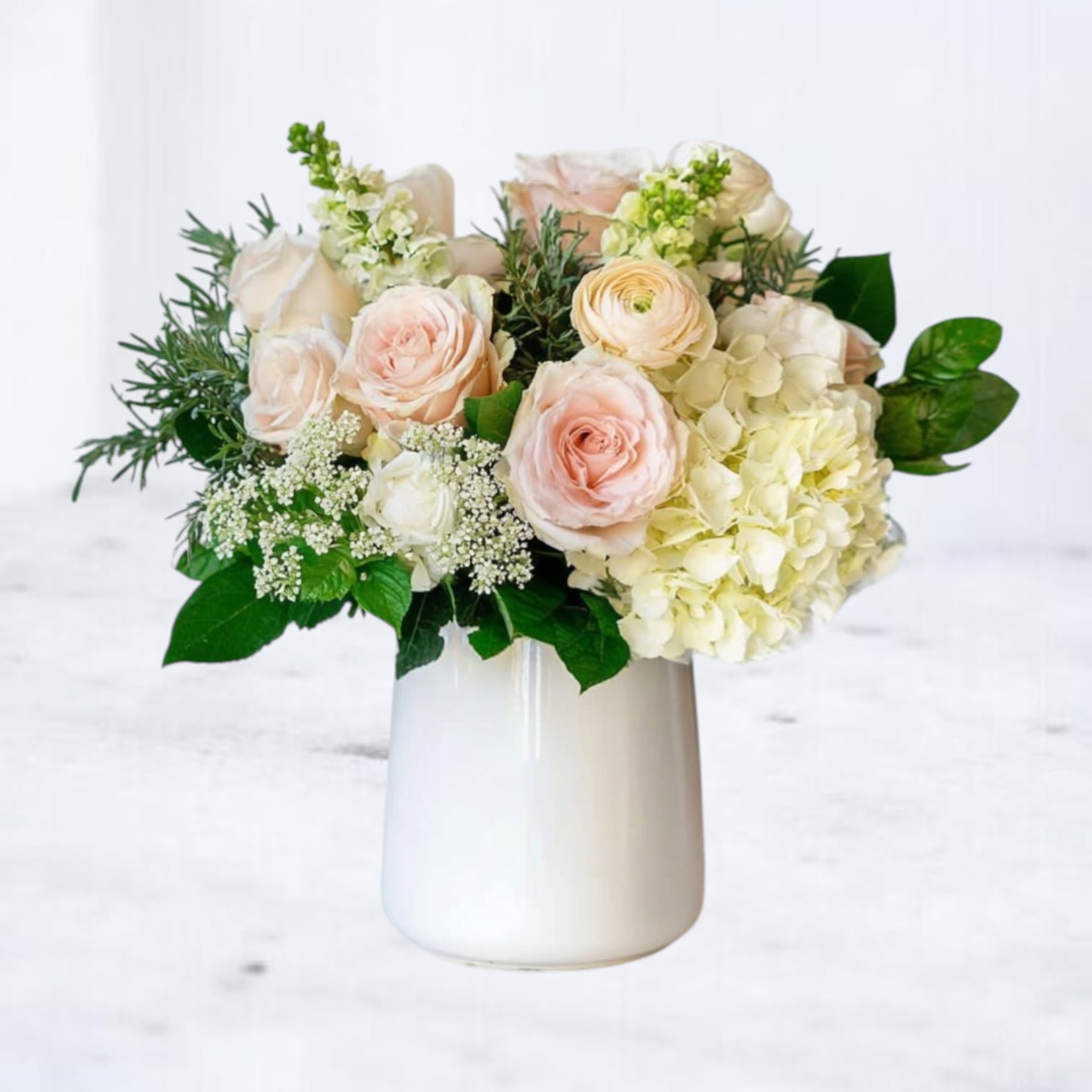 Camber - Camber is a soft and romantic arrangement featuring blush roses, creamy white blooms, and delicate seasonal accents arranged among fresh greenery. The neutral palette of soft peach and ivory creates a refined, airy design with a timeless feel.  Designed in a ceramic vase with a naturally balanced composition, Camber brings understated elegance to any space. Perfect for anniversaries, thoughtful gestures, or simply enjoying beautiful, everyday florals.  Whiskey Wallflower is a design-forward florist based in Magnolia, offering same-day flower delivery throughout Magnolia, Montgomery, The Woodlands, Conroe, Tomball, Willis, Spring, and surrounding North Houston communities. Each arrangement is thoughtfully composed using premium blooms, with a focus on modern design, quality, and intentional detail.  