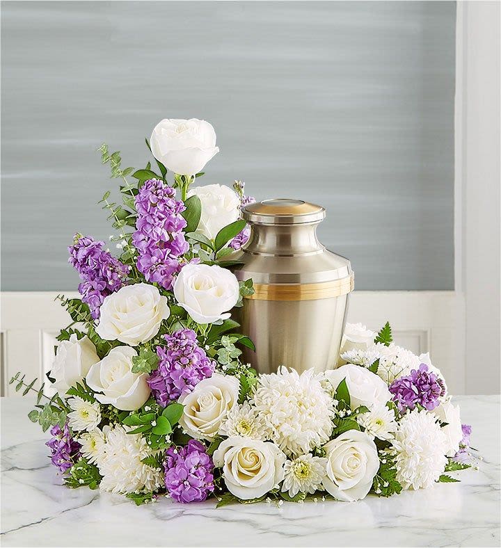 See You Again Cremation Arrangement - This arrangement features fluffy white mums that provide a solid, peaceful base, with a climb of flowers that creates a graceful, vertical line next to the urn.