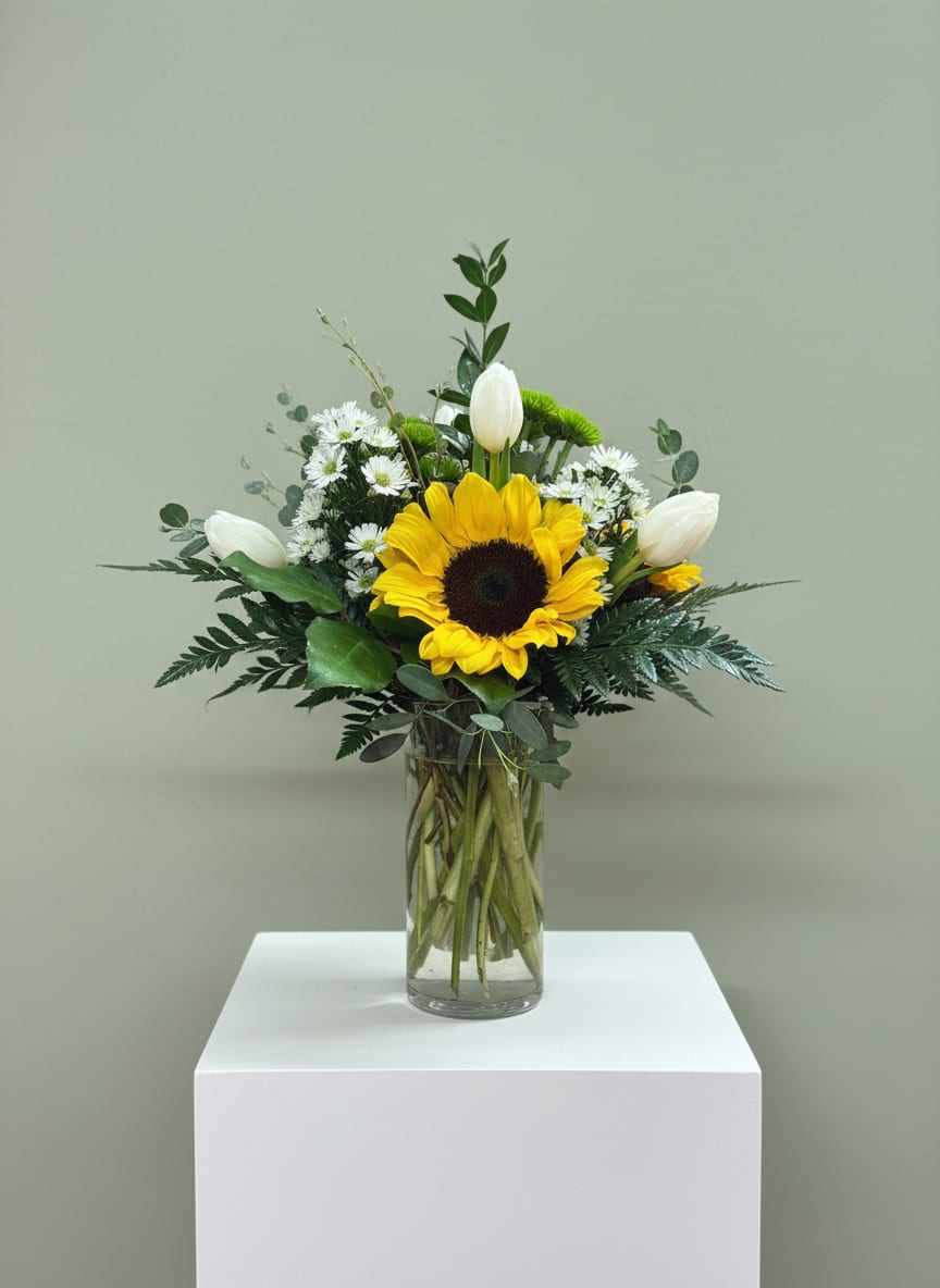 Something Simple - This simple arrangement is made with sunflowers, and green and white flowers too