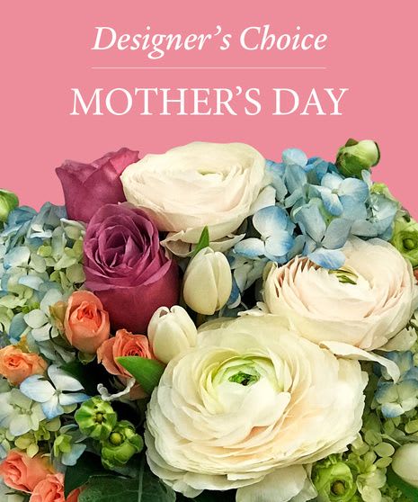 Bouquet of white, pink, and blue flowers against a pink Mother's Day background