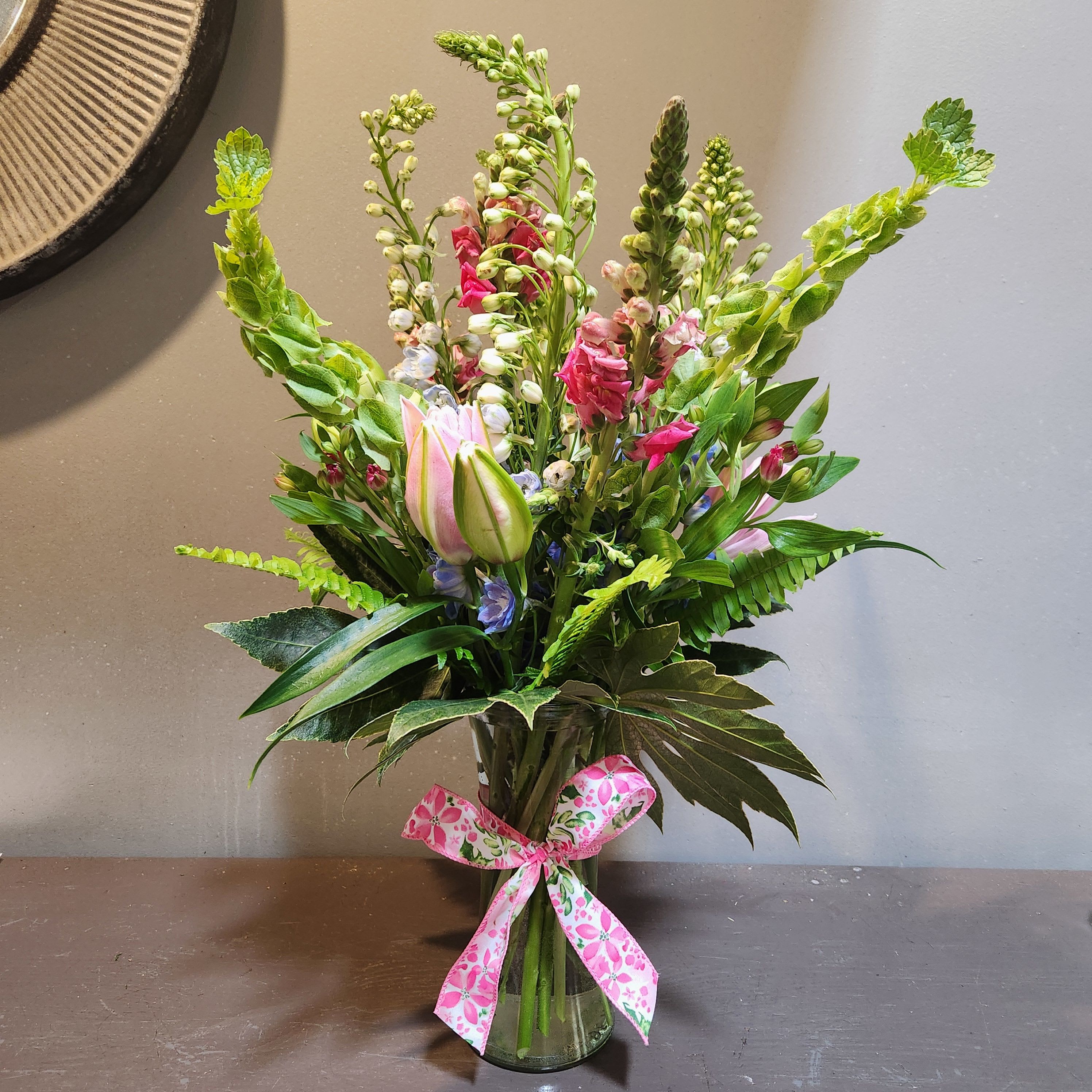 Reach for the Stars - This whimsically, vertical bouquet will bring joy to any room.  Approx. Dimensions: 26"Tx14"W and is filled with many MN Grown blooms!