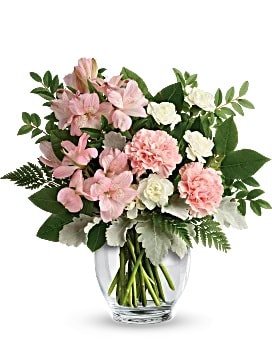Pink and white bouquet in a clear glass vase