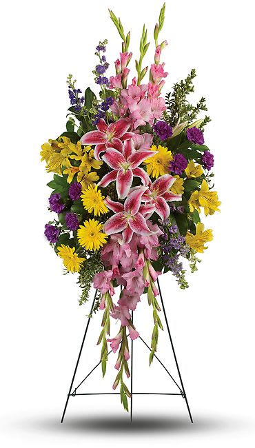 Rainbow Of Remembrance Standing Spray - Your sincere wishes for peace and harmony resonate beautifully in this perfectly balanced arrangement of pink lilies, yellow gerberas and purple larkspur.  This inspiring spray includes pink stargazer lilies, yellow gerberas, yellow alstroemeria, pink gladioli, purple carnations and purple larkspur accented with oregonia and lemon leaf. Note: Image shown is Premium.