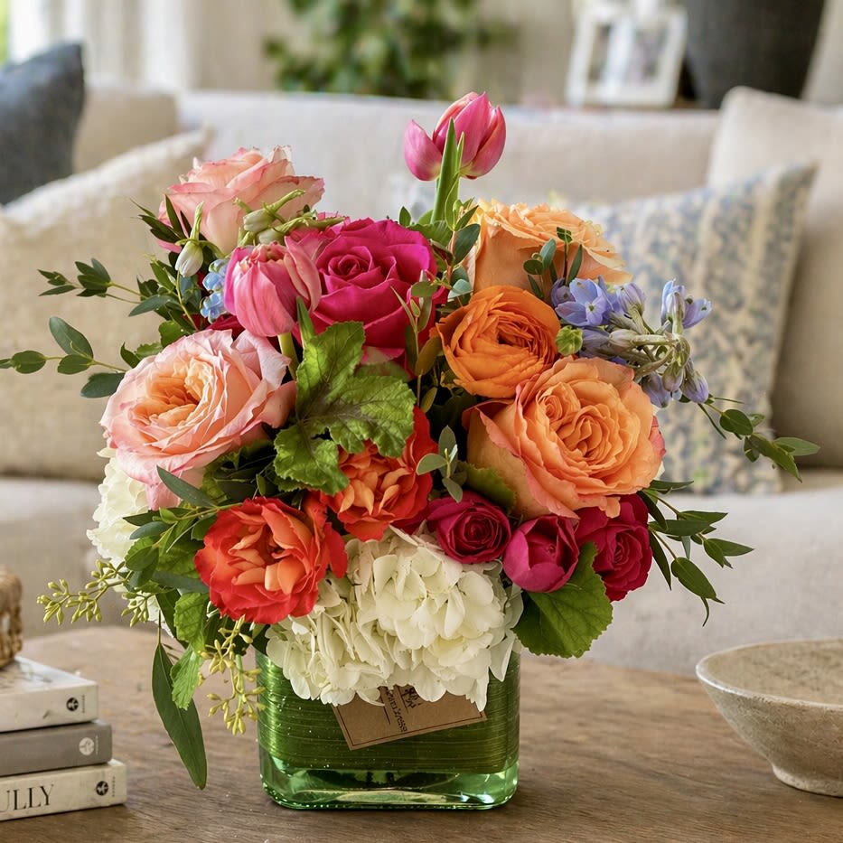 Sunlit Harmony – Vibrant Garden Flower Arrangement (Same-Day Delivery Los Angeles) - Bright, joyful, and full of color, Sunlit Harmony is a cheerful floral arrangement designed to bring warmth and beauty into any space. Featuring premium roses in peach, blush, coral, and hot pink tones, accented with seasonal blooms, hydrangea, tulips, ranunculus, and fresh greenery, this design creates a lively garden-inspired look with elegant texture and movement.  Arranged in a modern green glass vase, Sunlit Harmony makes a stunning gift for celebrations, anniversaries, thank you moments, housewarmings, congratulations, or simply to brighten someone’s day. Its rich color palette and fresh seasonal style make it a beautiful centerpiece for coffee tables, dining rooms, or office spaces.  Handcrafted with care by My Blooming Business using the freshest flowers available. Available for same-day flower delivery in Los Angeles, Eagle Rock, Glendale, Pasadena, Burbank, Highland Park, Silver Lake, and surrounding areas.  Perfect For: • Celebration Flowers • Thank You Gifts • Housewarming Flowers • Congratulations Flowers • Just Because Flowers • Home Decor Centerpiece  Design Details: • Premium mixed seasonal flowers • Roses, hydrangea, tulips, ranunculus &amp; accents • Modern green glass vase included • Garden-inspired compact design • Bright, elegant color palette  Flower varieties may vary based on seasonal availability while maintaining the overall color palette, style, and value.