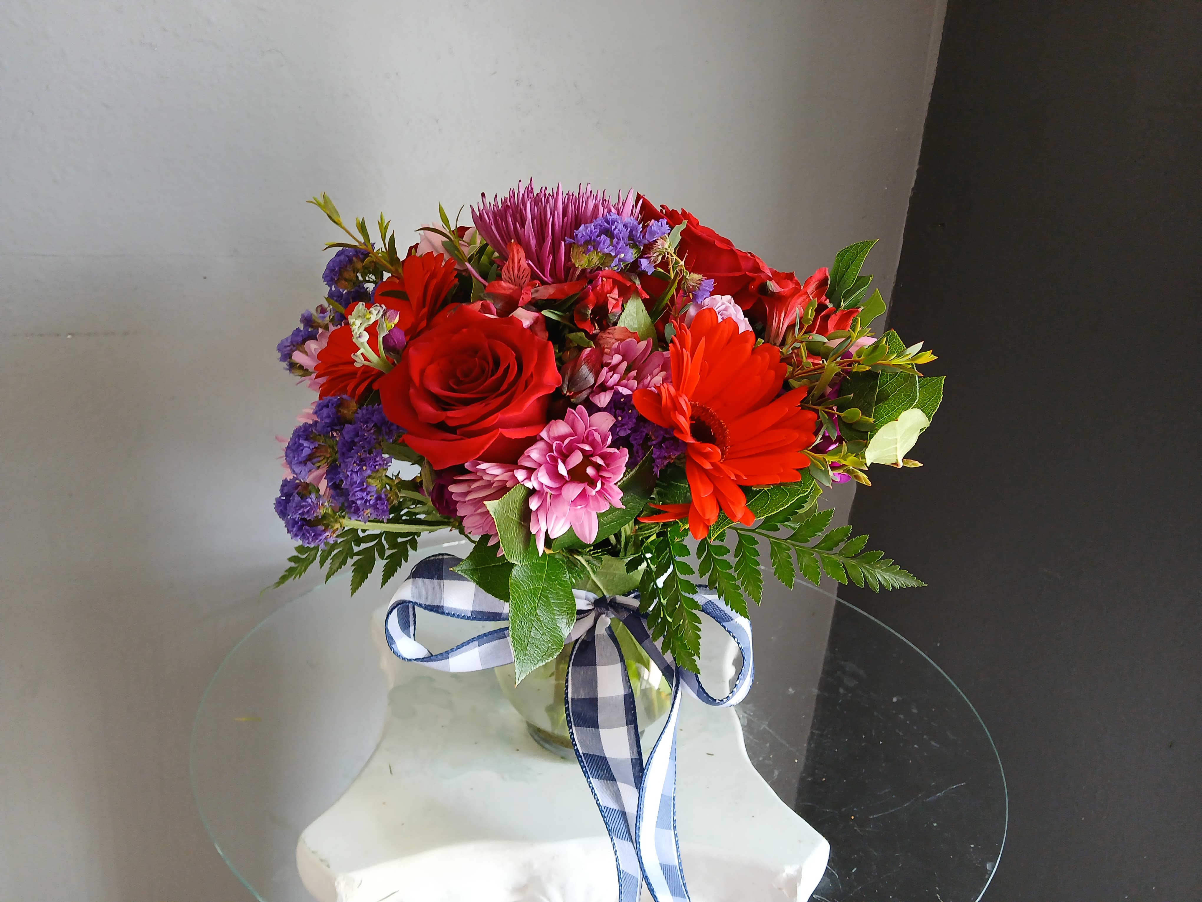 #704 Designer's Choice Vase Arrangement - This beautiful flower arrangement of fresh mixed seasonal blooms is made by local designers in the heart of Orange California. Hand crafted and perfect for every occasion, from birthdays and new babies to sympathy and just because. The best choice to show you are thinking of that special someone. Can be sent as a local delivery or in-store pickup. This is an original, one of a kind arrangement. Order now before it's too late!  UPGRADES: All upgrades are applied at the designer’s discretion and fulfilled to value using the freshest seasonal and/or premium flowers available. Container upgrades may be included when possible; otherwise, value is reflected in the floral selection while maintaining the original design style.