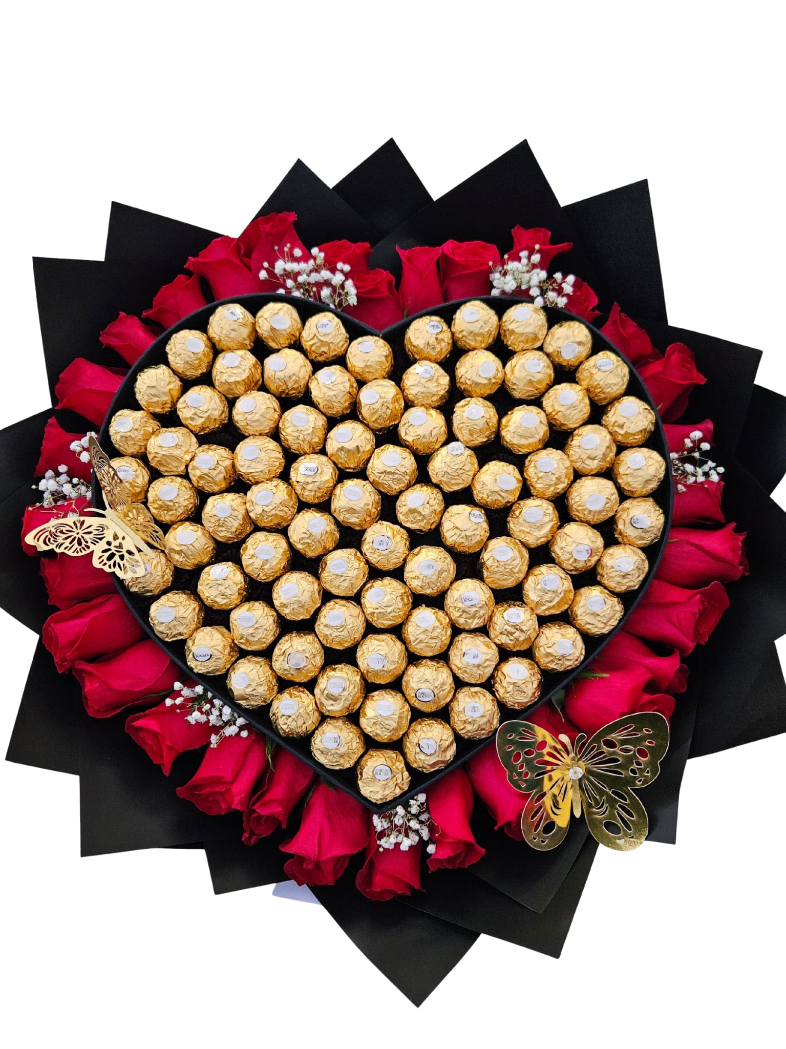 Heart-shaped chocolate gift with red roses and black wrapping