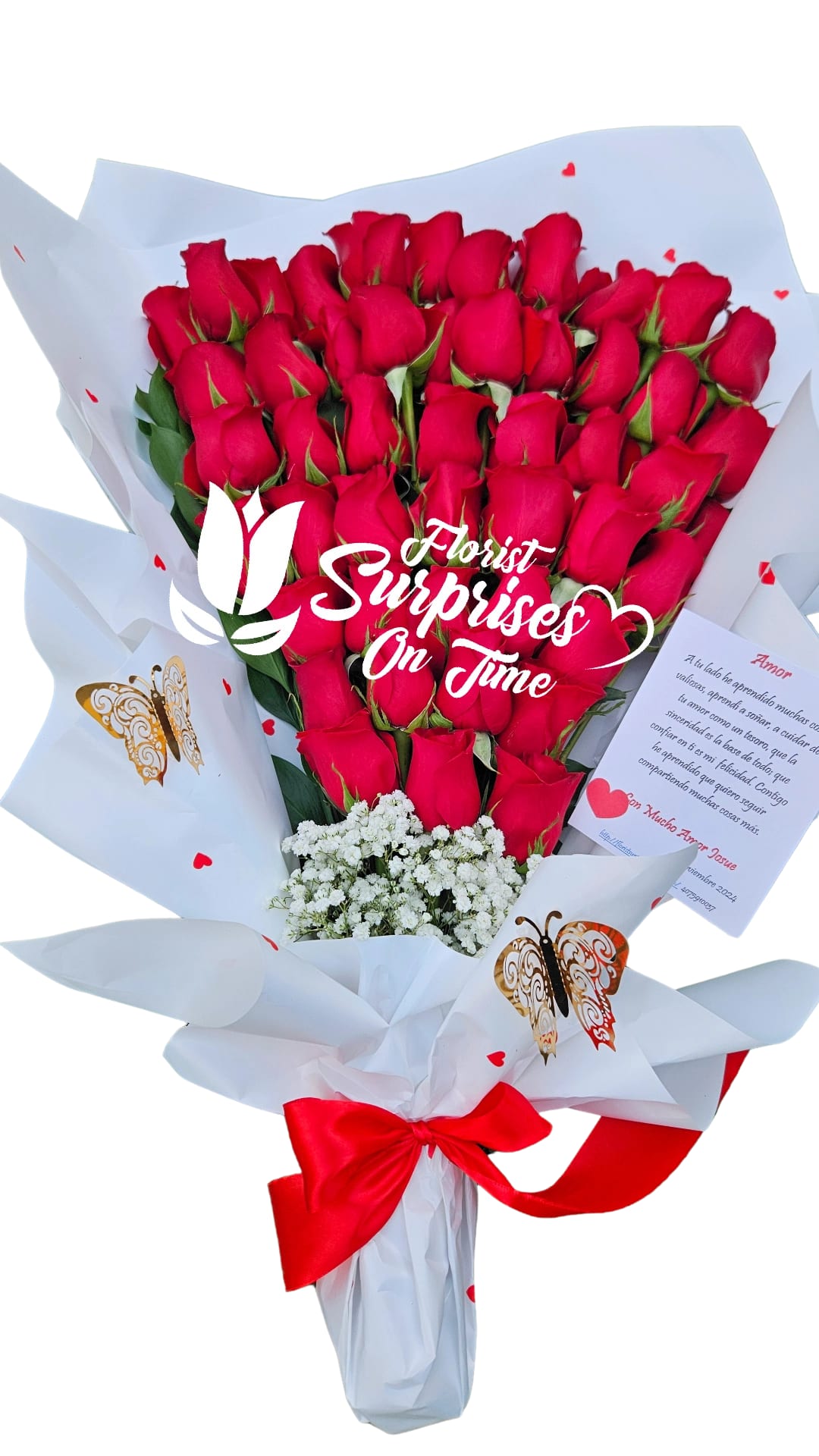 Bouquet of red roses wrapped in white paper with a red ribbon