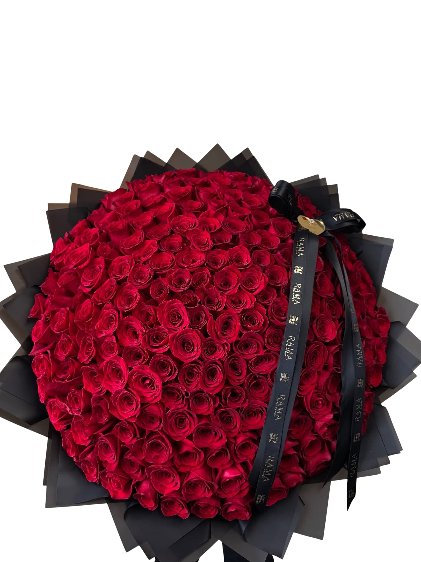 Large bouquet of red roses wrapped in black paper with a ribbon