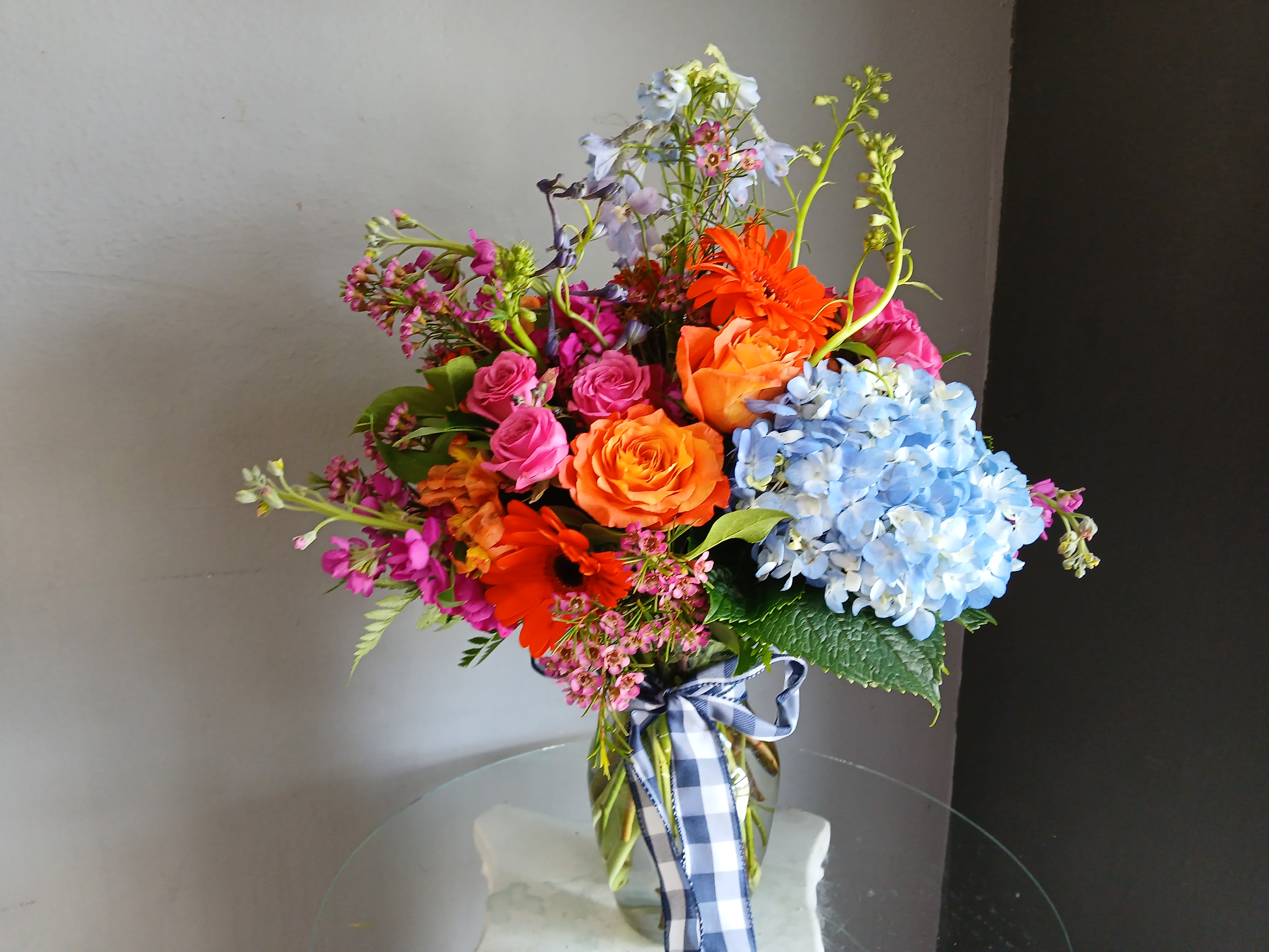 #713 Designer's Choice Vase Arrangement - This beautiful flower arrangement of fresh mixed seasonal blooms is made by local designers in the heart of Orange California. Hand crafted and perfect for every occasion, from birthdays and new babies to sympathy and just because. The best choice to show you are thinking of that special someone. Can be sent as a local delivery or in-store pickup. This is an original, one of a kind arrangement. Order now before it's too late!  UPGRADES: All upgrades are applied at the designer’s discretion and fulfilled to value using the freshest seasonal and/or premium flowers available. Container upgrades may be included when possible; otherwise, value is reflected in the floral selection while maintaining the original design style.