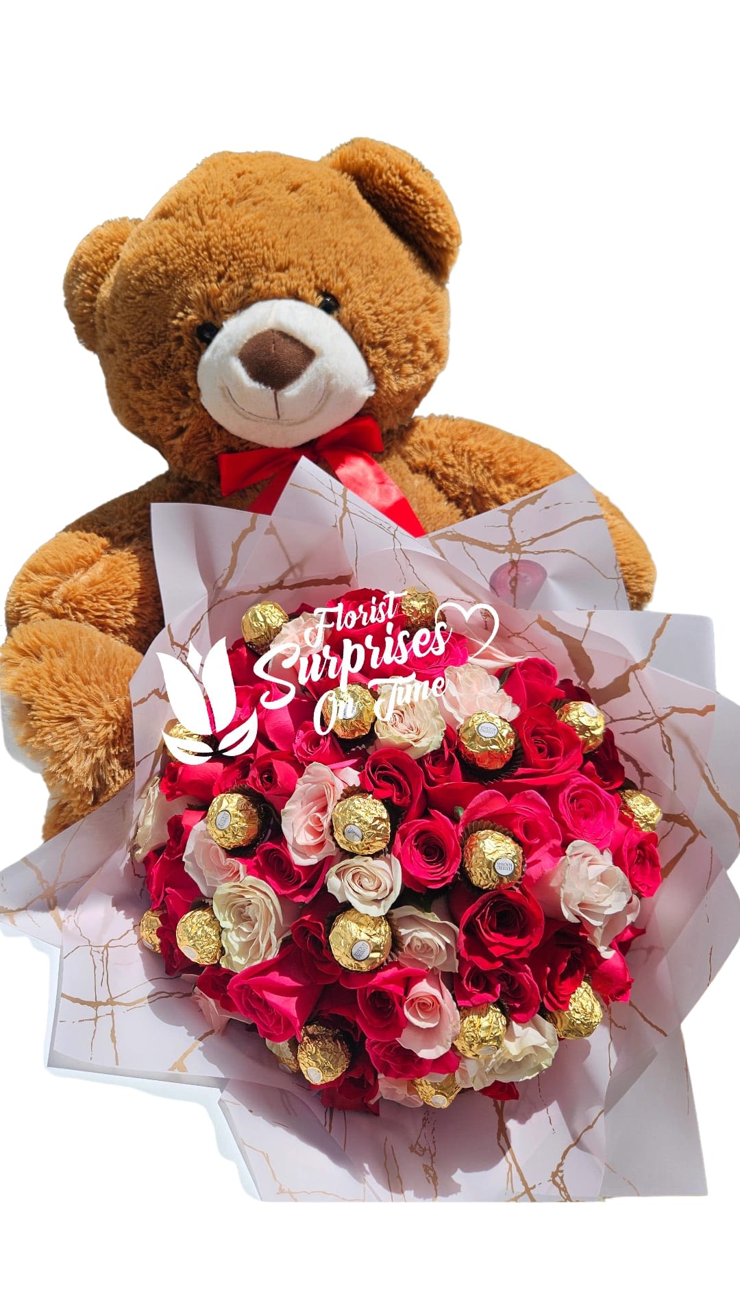 Teddy bear holding a bouquet of red and pink roses with chocolates