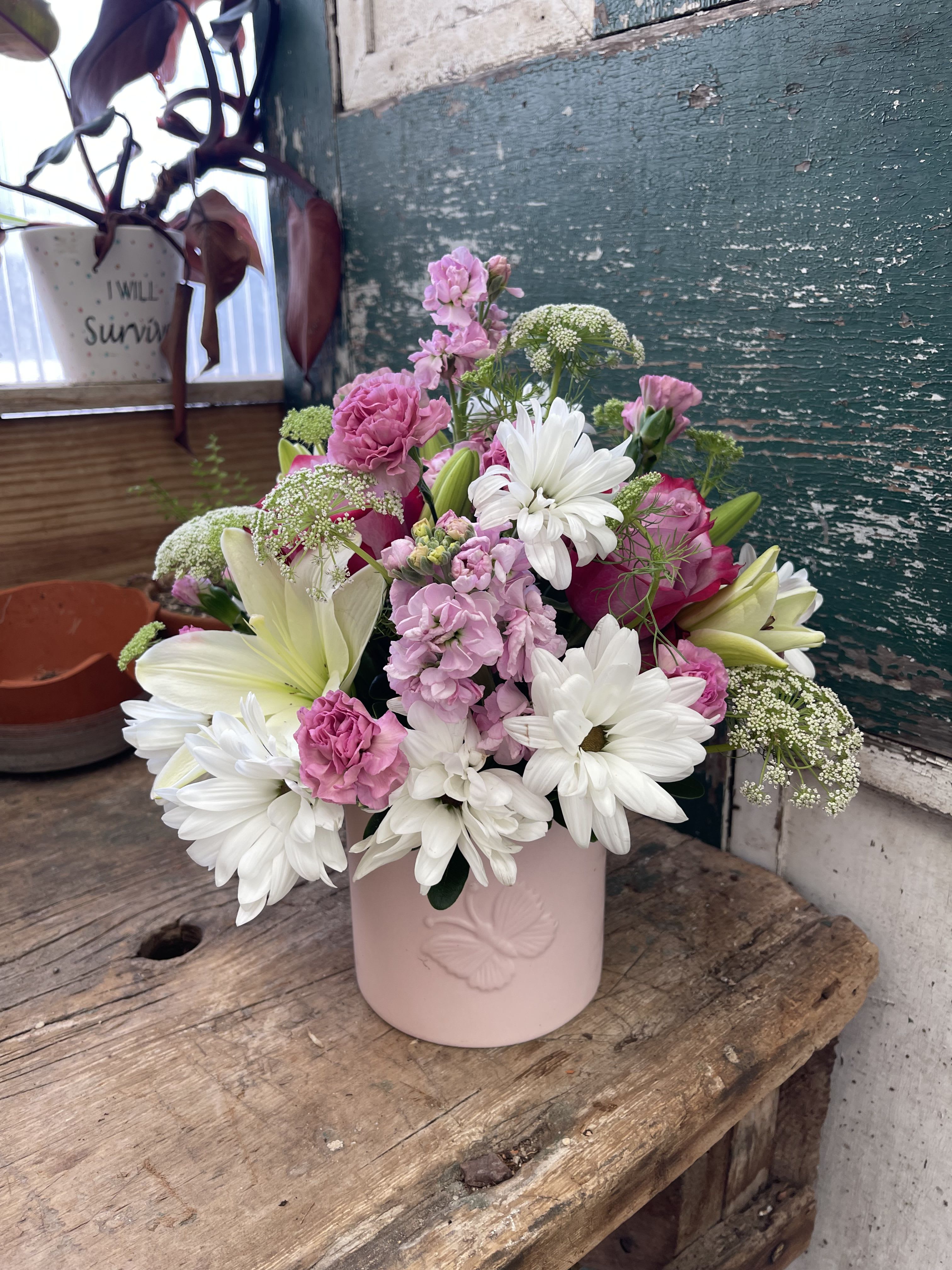 Pink and white mixed bouquet in a blush vase