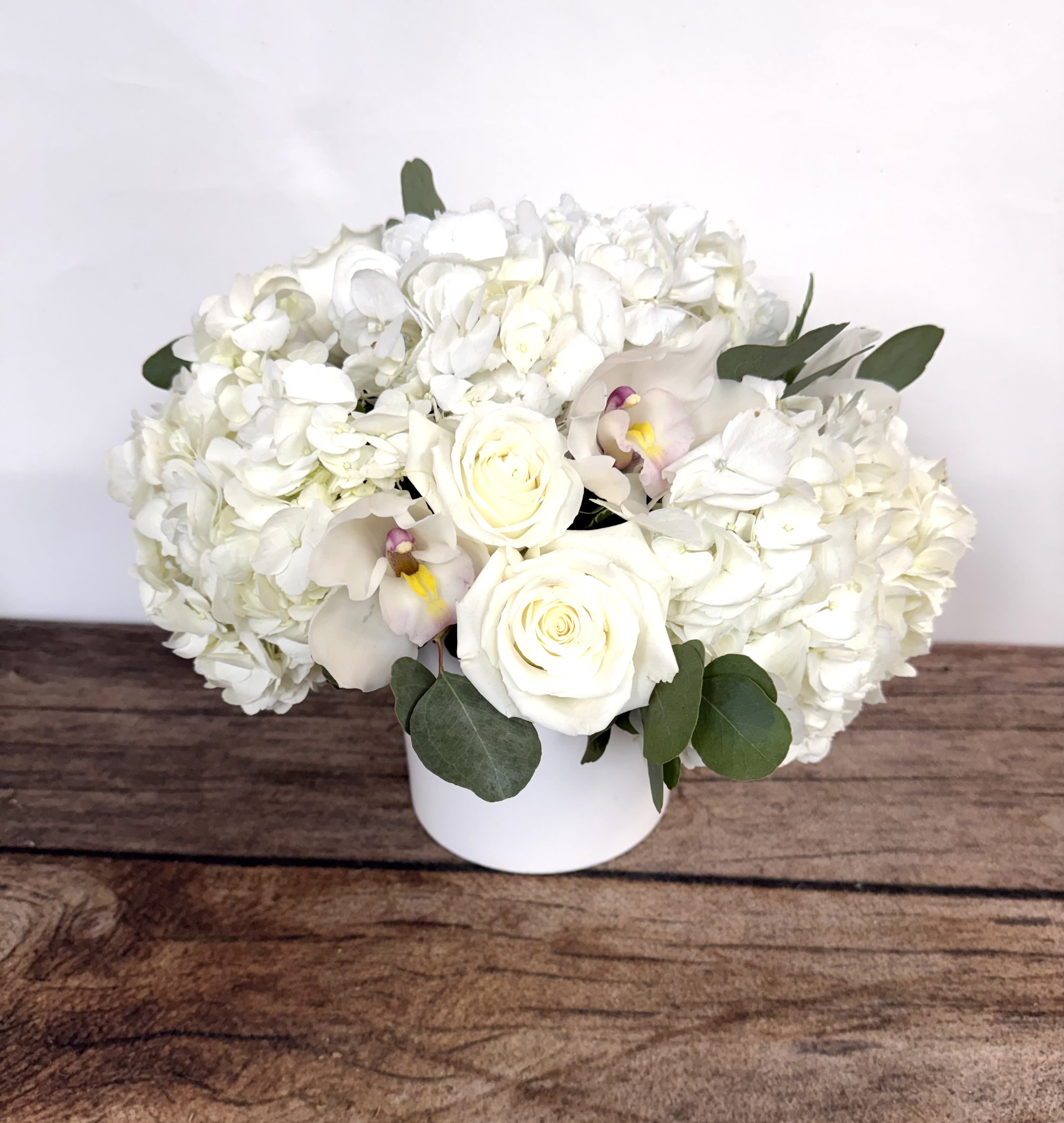 Diamond - Pure as the stone, this all white arrangement is modern yet traditional. Approx. 12"x12".