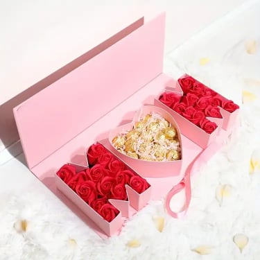 Sweet Luxury Box – Chocolate &amp; Floral Gift Set - This luxury gift box is a beautifully curated combination of sweetness and elegance, perfect for birthdays, celebrations, or romantic surprises in Orlando and surrounding areas. The standard version features a premium selection of chocolates presented in an elegant box with a stylish ribbon. For a more elevated experience, you can upgrade to include fresh flowers, transforming this gift into a stunning floral and chocolate arrangement. Each box is carefully designed to feel special, refined, and ready to impress. Whether you’re sending a thoughtful gesture or a statement gift, this set offers a perfect balance of beauty and indulgence. Available for delivery in Orlando, Altamonte Springs, Winter Park, and nearby areas.