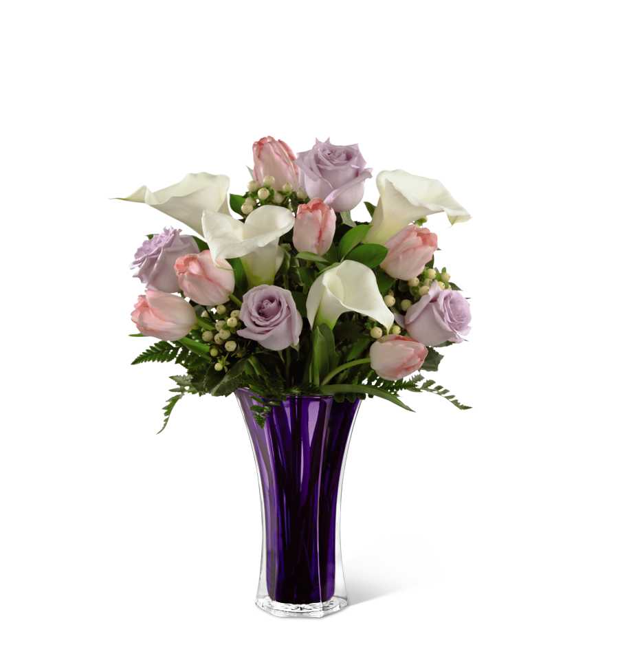 Pink and lavender roses with white calla lilies in a purple vase