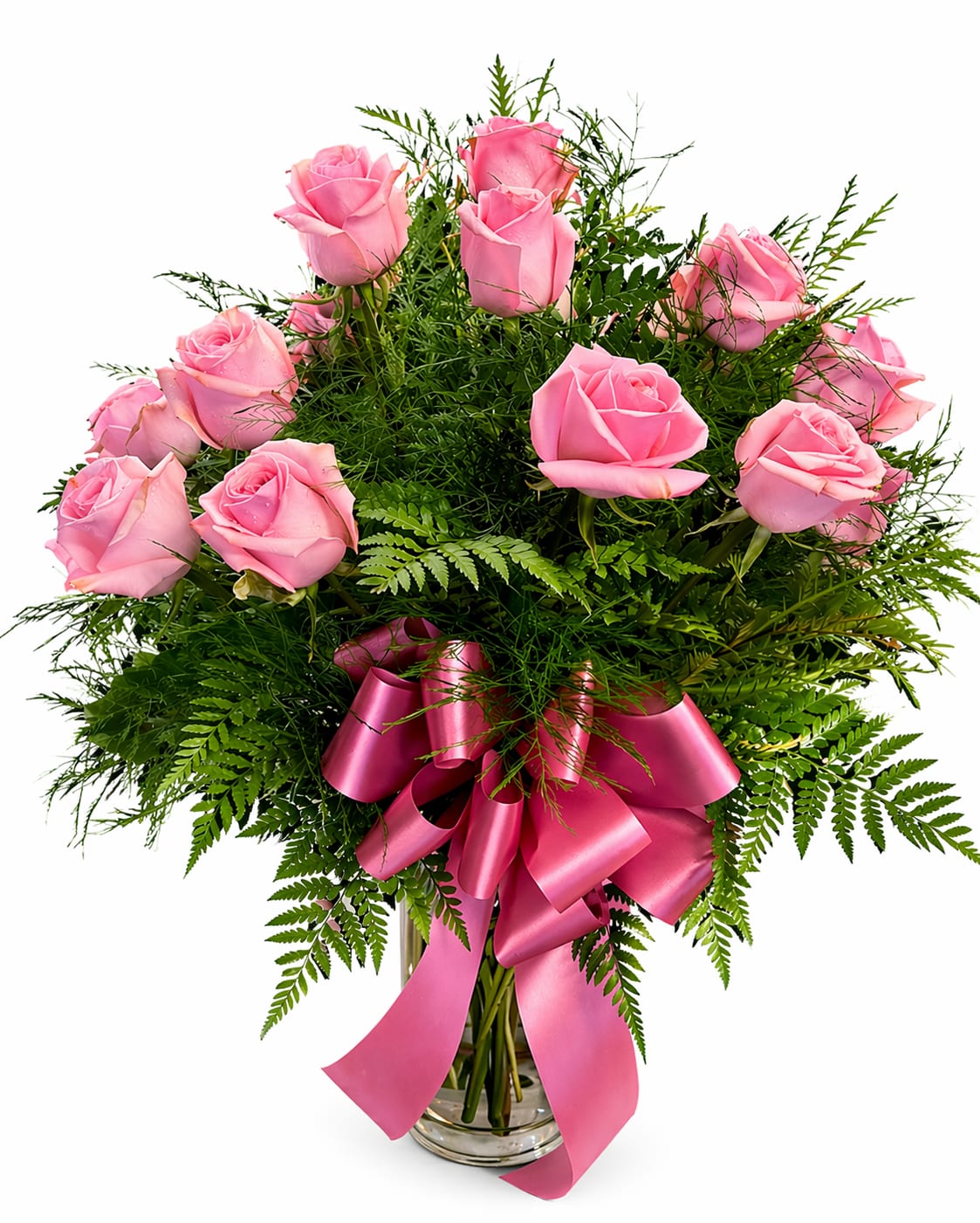 Pink roses in a clear glass vase with a pink ribbon bow