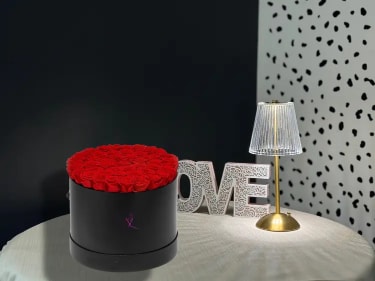 Classic 50 Roses Hat Box - Classic 50 Roses Hat Box is a luxurious floral arrangement featuring fifty fresh, premium roses elegantly arranged in a modern hat box. This design highlights the natural beauty and fullness of roses, creating a rich and balanced composition with a clean, sophisticated look. The structured hat box adds a contemporary touch while keeping the flowers perfectly styled and easy to display. Perfect for romantic occasions, anniversaries, birthdays, or grand gestures, this arrangement makes a bold and elegant statement. Each piece is handcrafted and may vary slightly to ensure the freshest flowers and the highest quality.